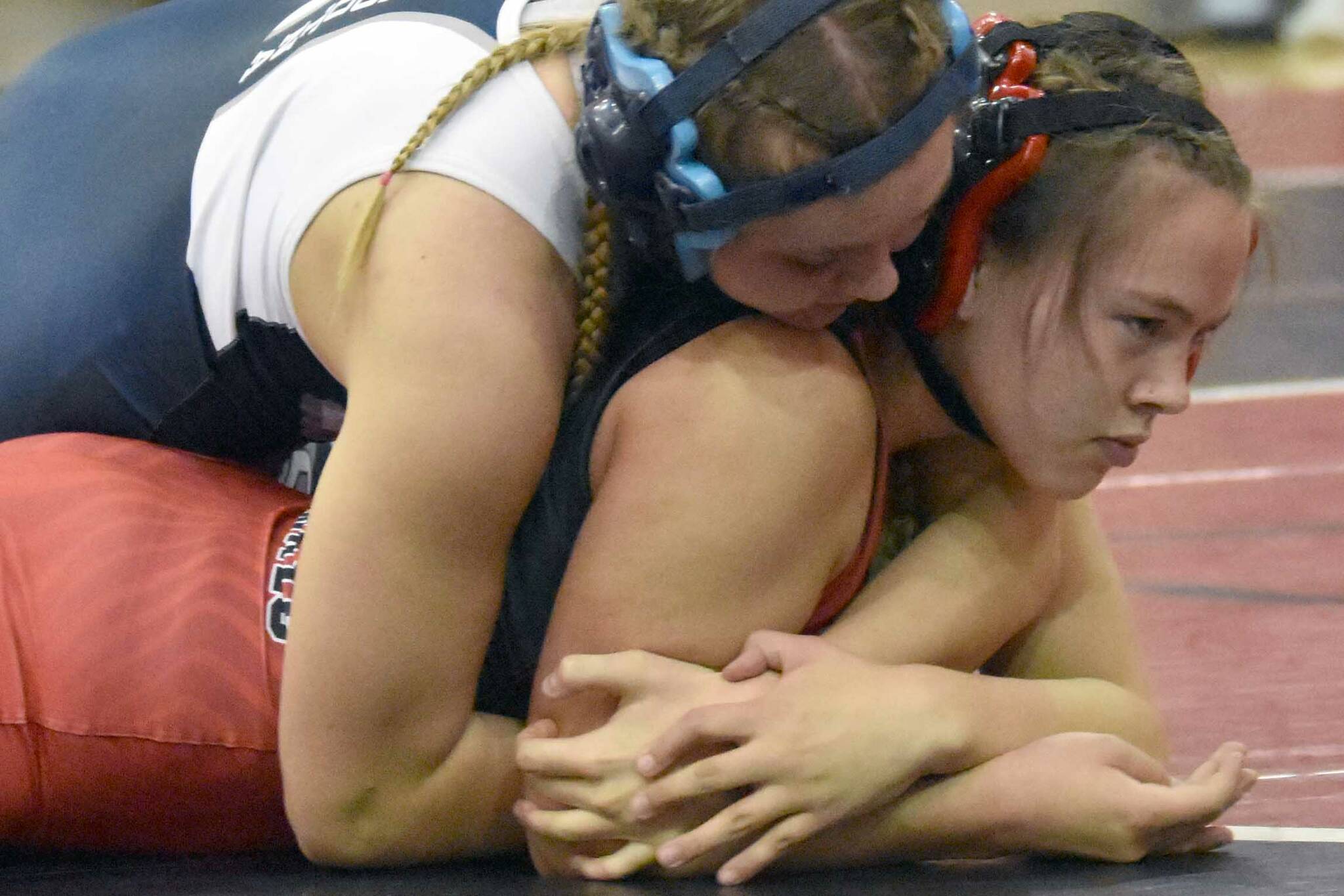 Soldotna's Daisy Hannevold wrestles with Kenai Central's Jalyn Yeoman at girls 138 pounds at the Luke Spruill Memorial Tournament on Saturday, Oct. 22, 2022, at Kenai Central High School in Kenai, Alaska. Hannevold was able to pin Yeoman. (Photo by Jeff Helminiak/Peninsula Clarion)