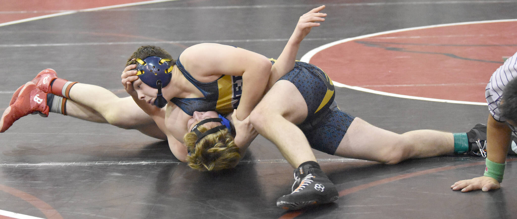 Homer’s Brayden Woods wrestles with Soldotna’s Liam Boyd at 160 pounds at the Luke Spruill Memorial Tournament on Saturday, Oct. 22, 2022, at Kenai Central High School in Kenai, Alaska. Woods was able to pin Boyd. (Photo by Jeff Helminiak/Peninsula Clarion)