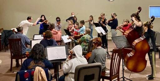 A Homer Youth Orchestra Club rehearsal is conducted by Abimael Melendez. (Photo Courtesy Kim Fine)