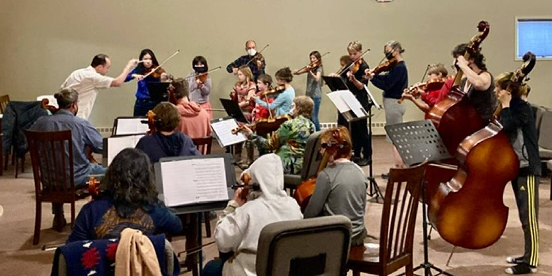 A Homer Youth Orchestra Club rehearsal is conducted by Abimael Melendez. (Photo Courtesy Kim Fine)