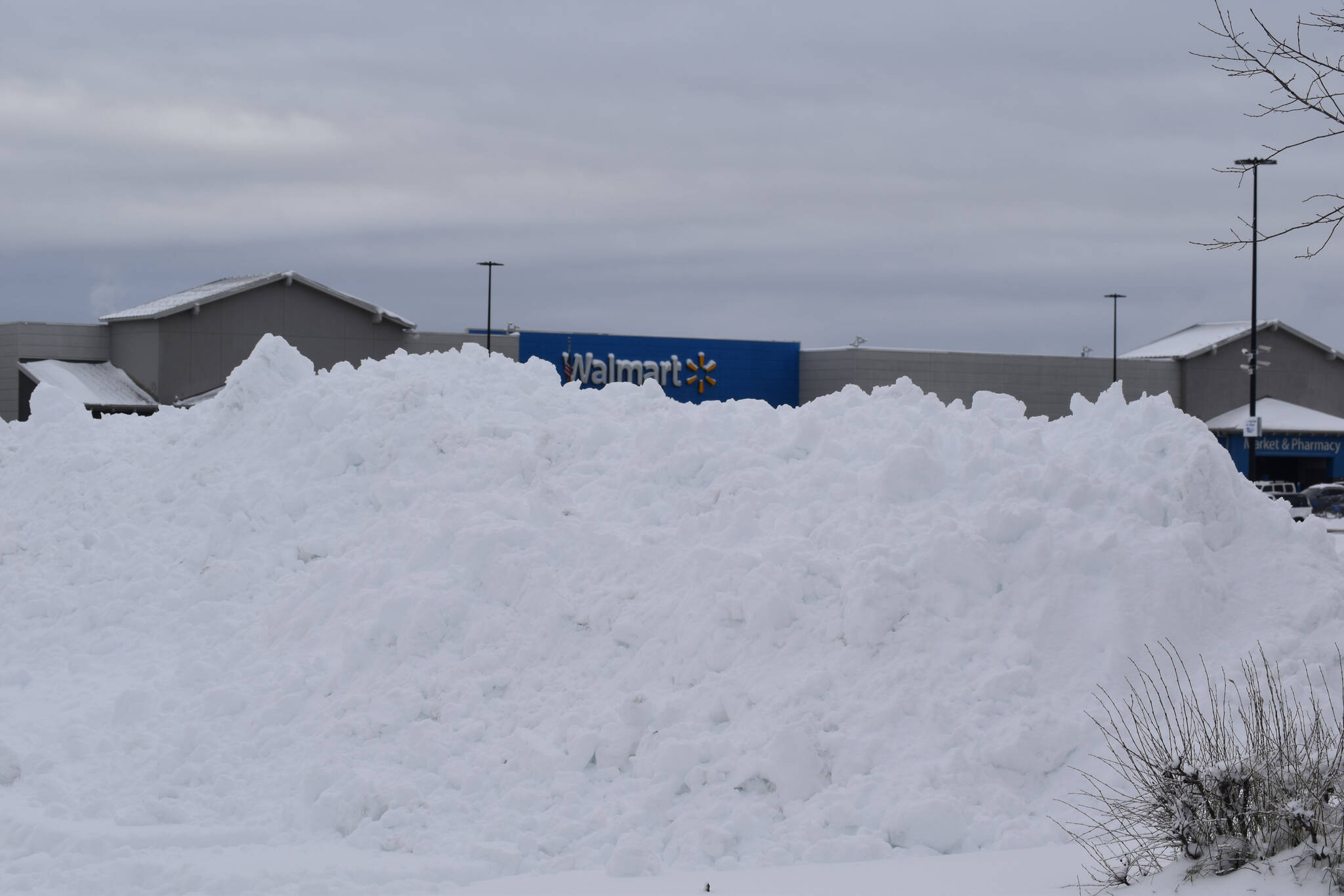 A pile of snow is seen in the Walmart parking lot on Wednesday, Oct. 26, 2022. (Jake Dye/Peninsula Clarion)