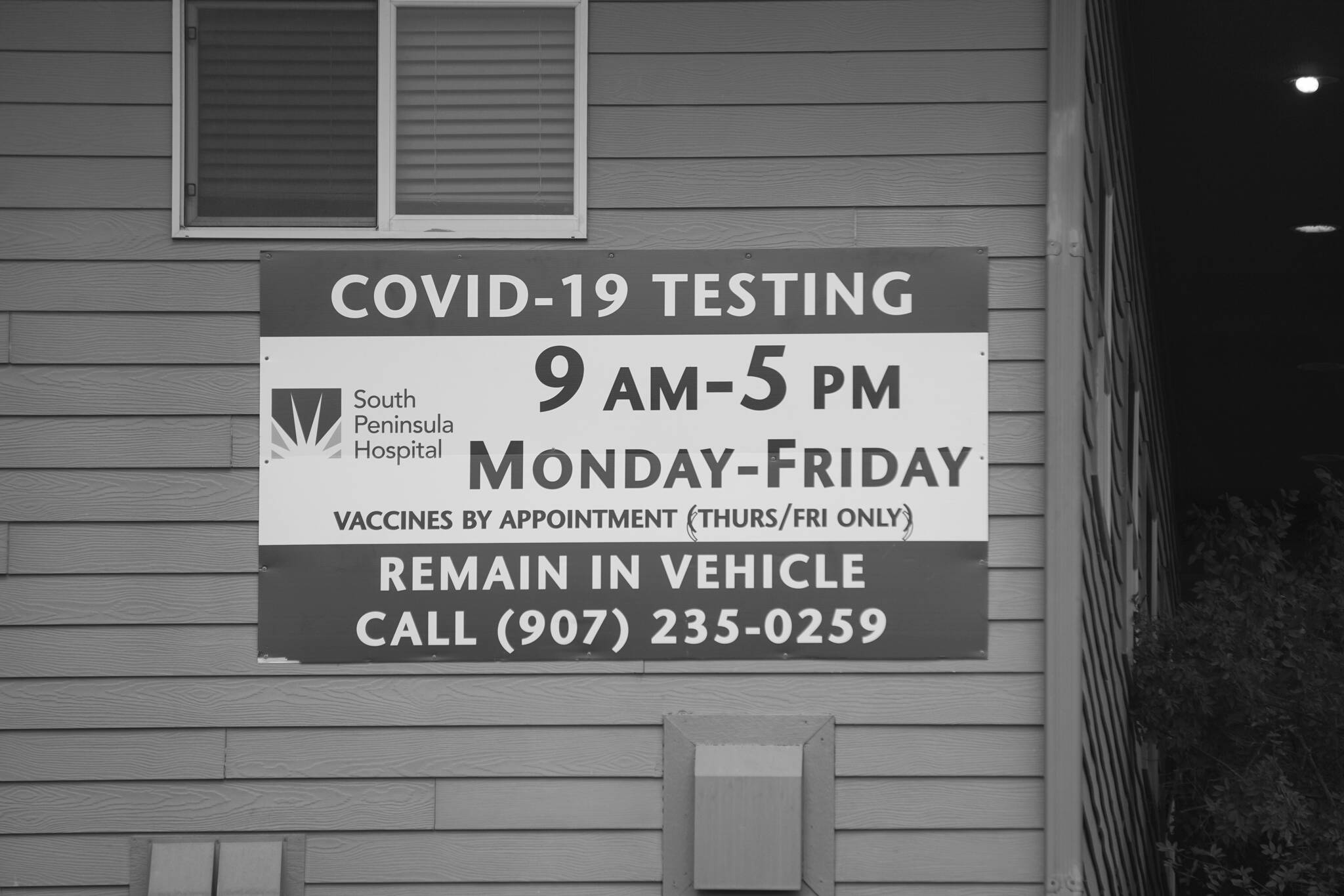 Photo by Michael Armstrong/Homer News
A sign at the South Peninsula Hospital COVID-19 vaccine and testing clinic provides information and hours for testing and vaccines at the Bartlett Street building in Homer.