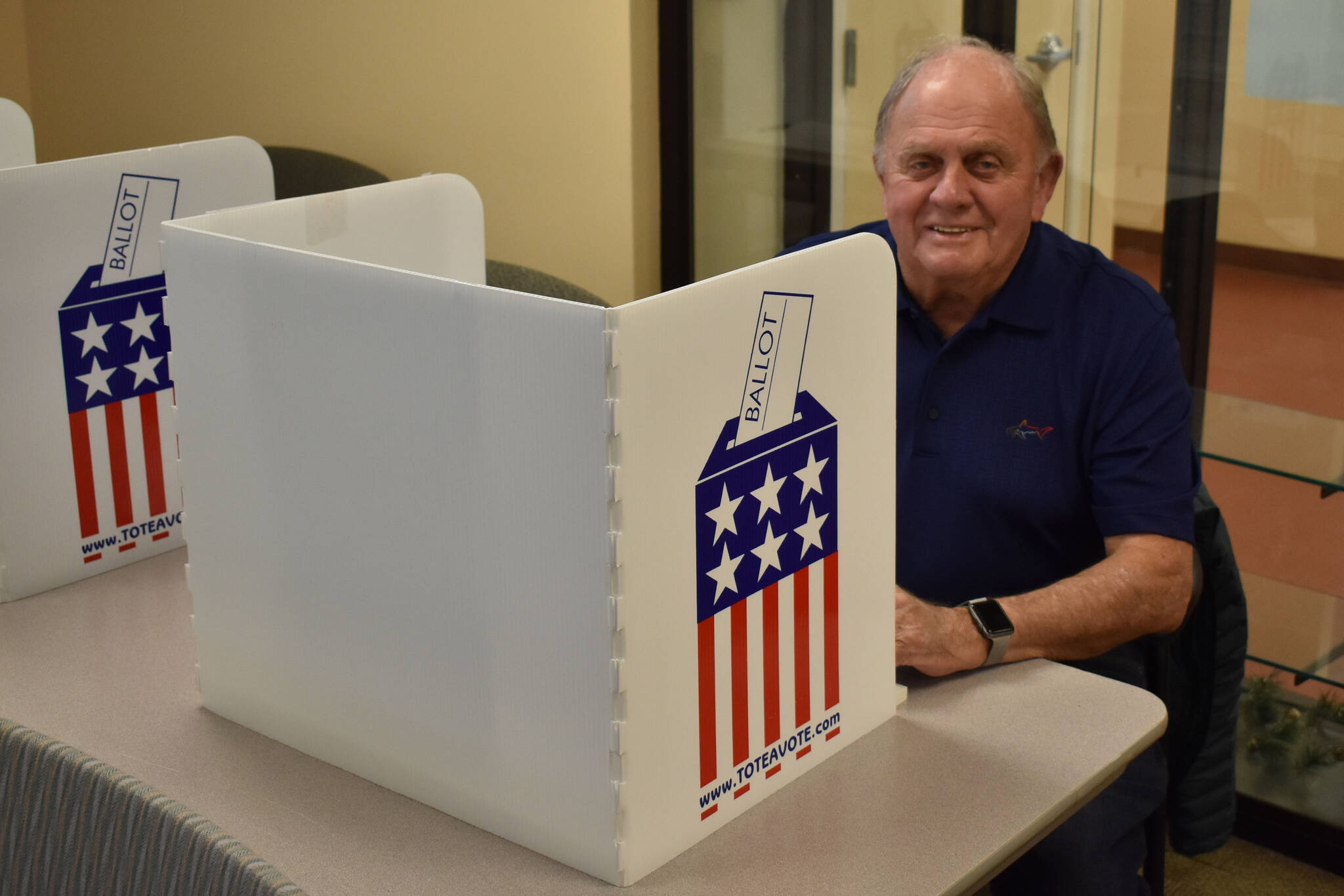 Gary Anderson fills out an early voting ballot on Thursday, Oct. 27, 2022, at Kenai City Hall in Kenai, Alaska. (Jake Dye/Peninsula Clarion)