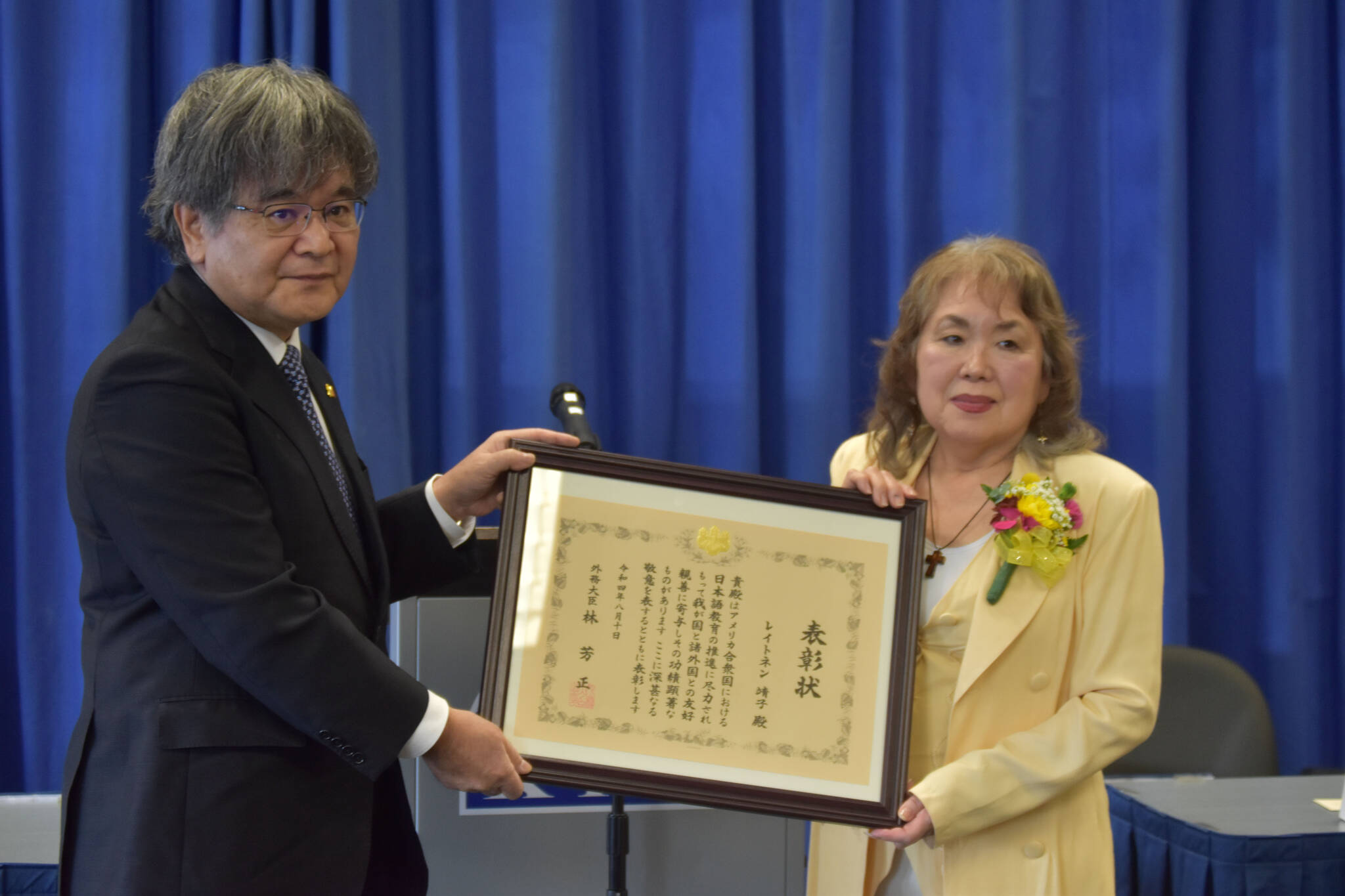 Consular Masaru Aniya bestows Yasuko Lehtinen with the Foreign Minister Commendation on Friday, Oct. 28, 2022, at Kenai Peninsula College in Soldotna, Alaska. (Jake Dye/Peninsula Clarion)