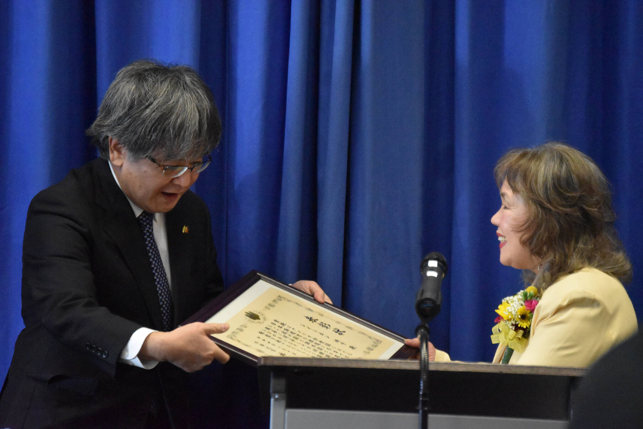 Consular Masaru Aniya bestows Yasuko Lehtinen with the Foreign Minister Commendation on Friday, Oct. 28, 2022, at Kenai Peninsula College in Soldotna, Alaska. (Jake Dye/Peninsula Clarion)