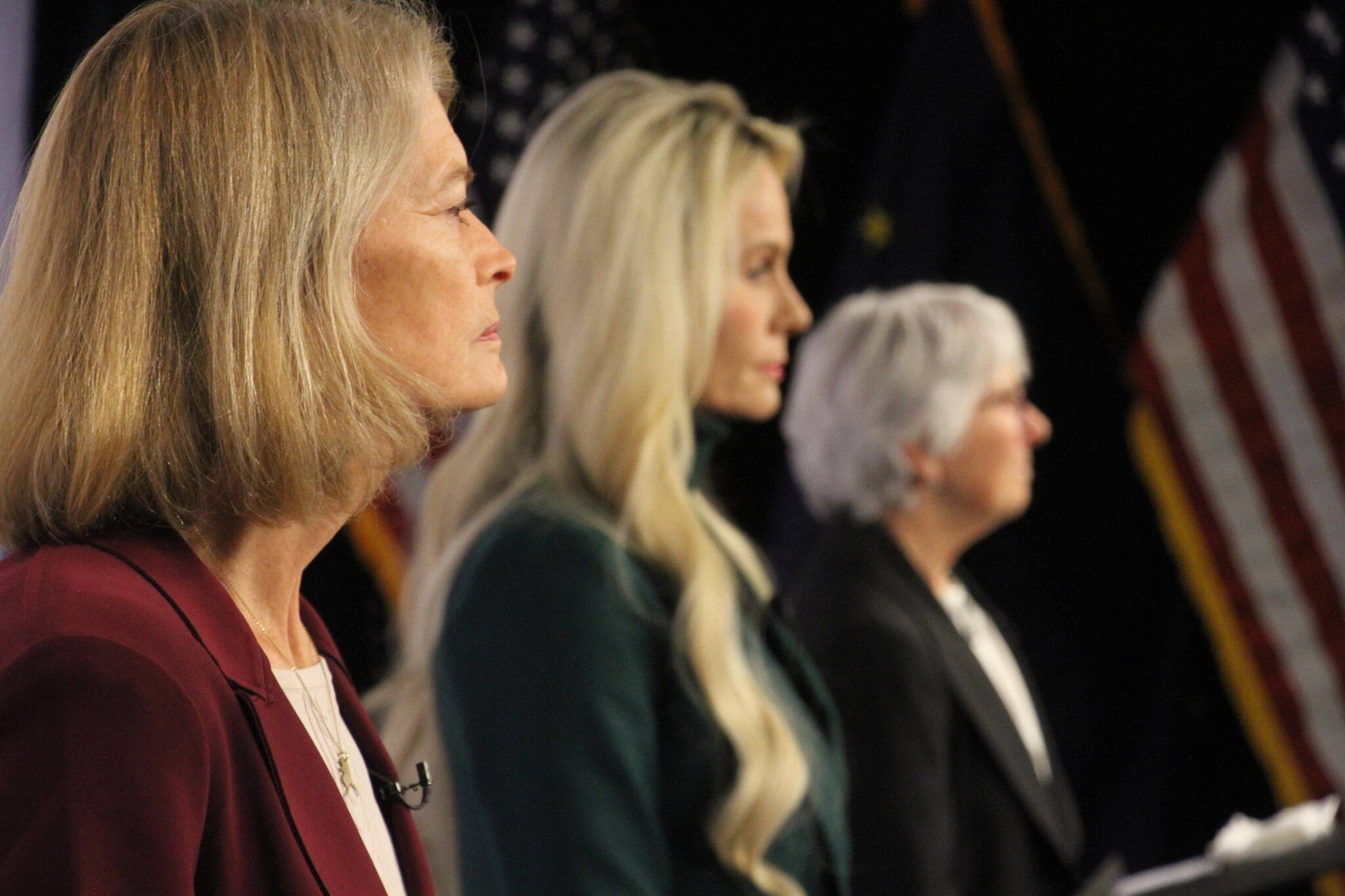 United States Sen. Lisa Murkowski, left, a Republican, looks on Thursday, Oct. 27, 2022, prior to a U.S. Senate debate in Anchorage, Alaska. She faces Republican Kelly Tshibaka, center, and Democrat Pat Chesbro, right, in the general election. (AP Photo/Mark Thiessen)