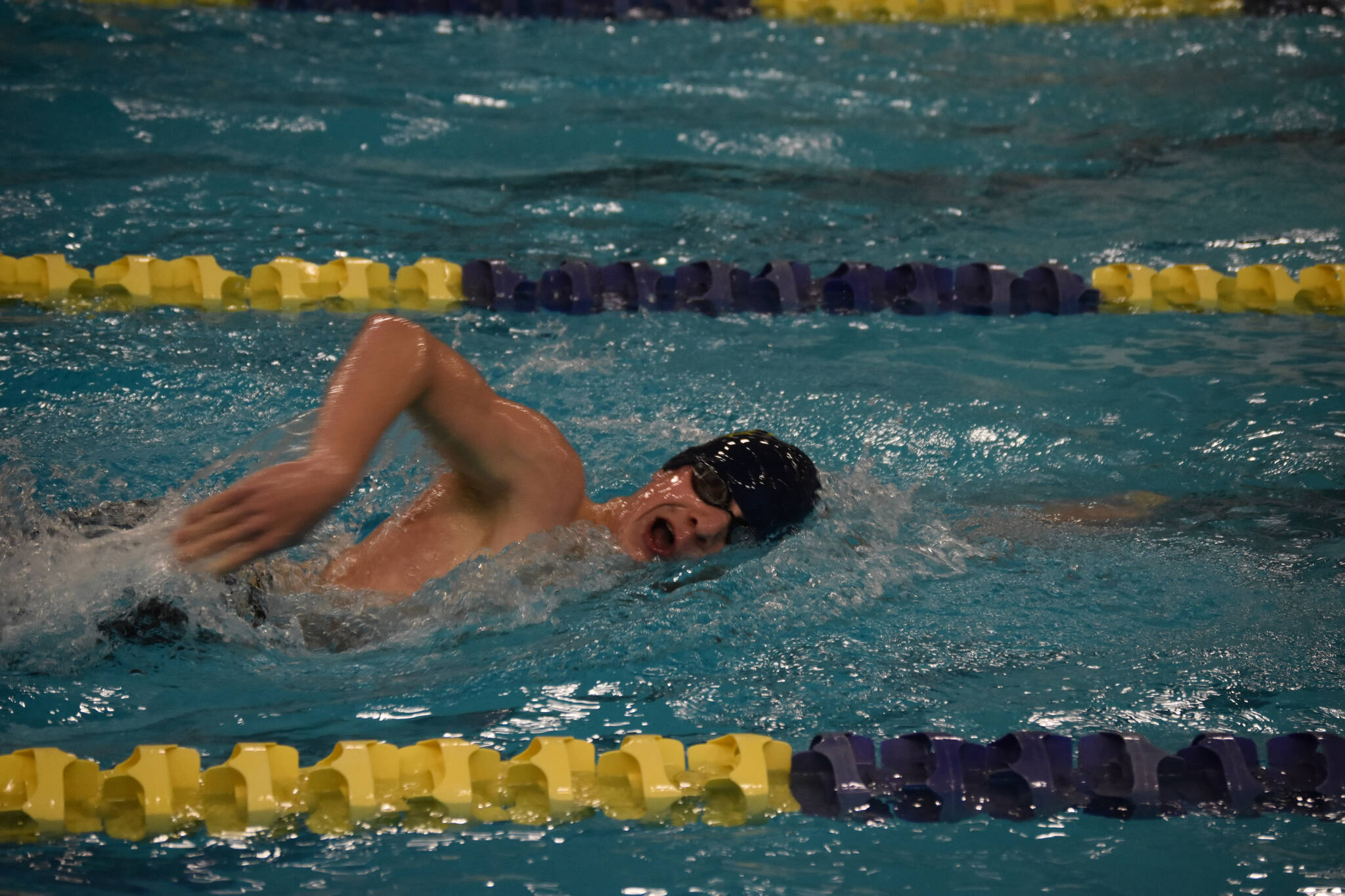 Hunter Fry, of Homer, swims the 500 yard freestyle during finals at the ASAA State Swim & Dive Championships on Saturday, Nov. 5, 2022, at Bartlett High School in Anchorage, Alaska. (Jake Dye/Peninsula Clarion)