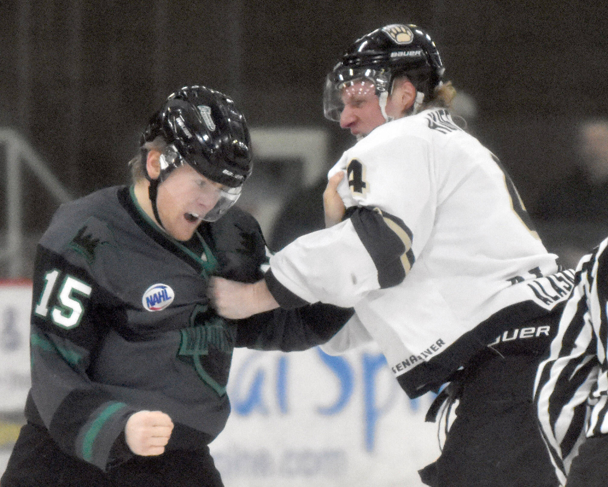 Cole Gordon of the Minnesota Wilderness and Caleb Huffman of the Kenai River Brown Bears fight Saturday, Nov. 5, 2022, at the Soldotna Regional Sports Complex in Soldotna, Alaska. (Photo by Jeff Helminiak/Peninsula Clarion)