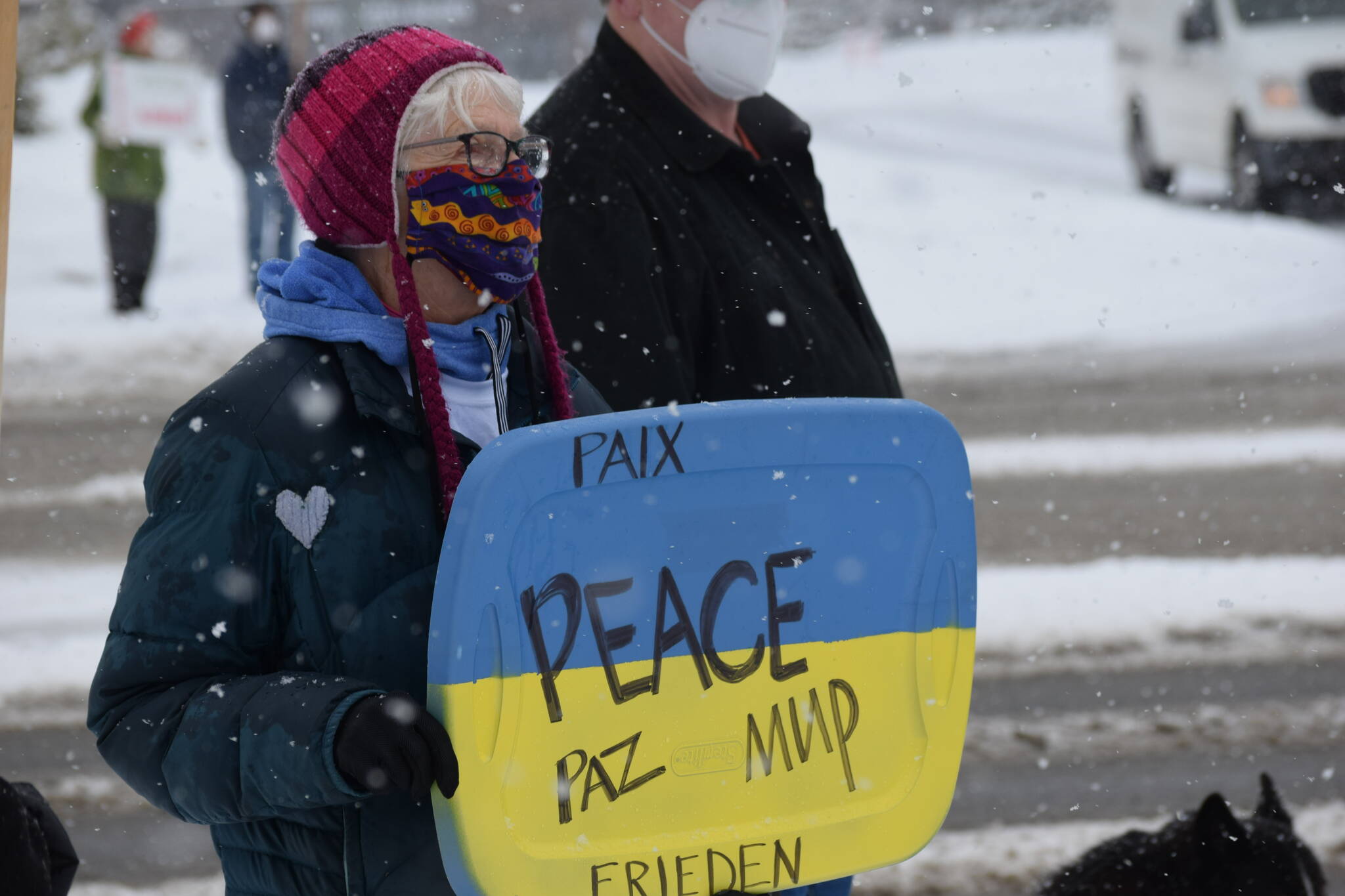 Susie Smalley demonstrates during the Many Voices Ukraine vigil on Saturday, March 5, 2022, in Soldotna, Alaska. (Camille Botello/Peninsula Clarion)