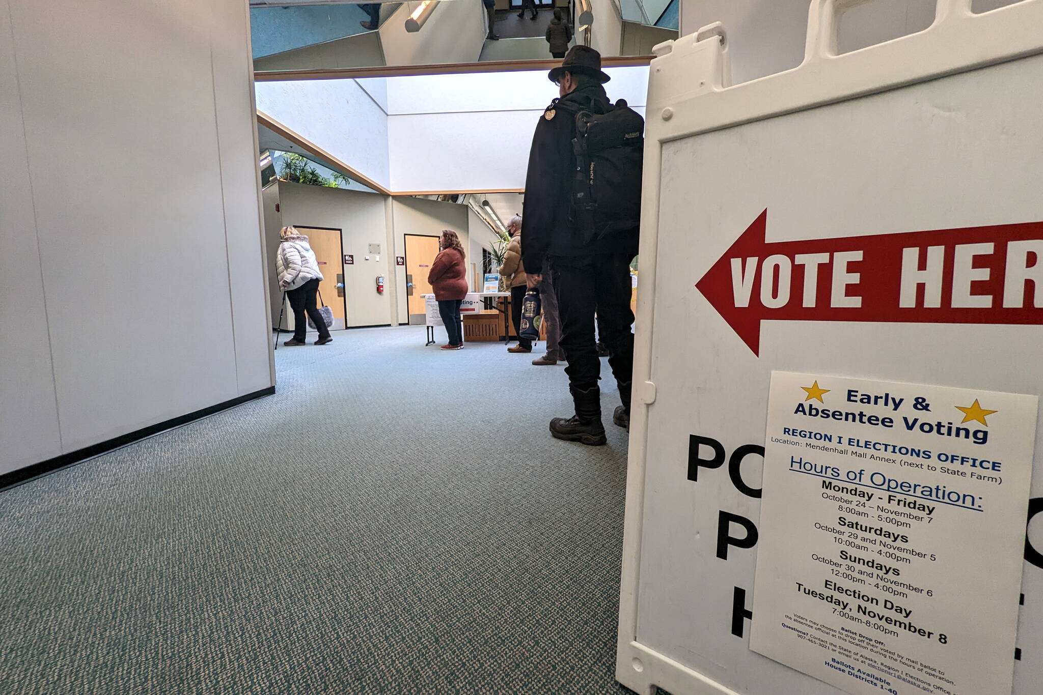 A sign directs early voters to the polling station at the Mendenhall Mall on Monday. The mall is one of two early voting locations in Juneau, but more than a dozen polling locations will be open from 7 a.m. to 8 p.m. on Tuesday. (Ben Hohenstatt / Juneau Empire)