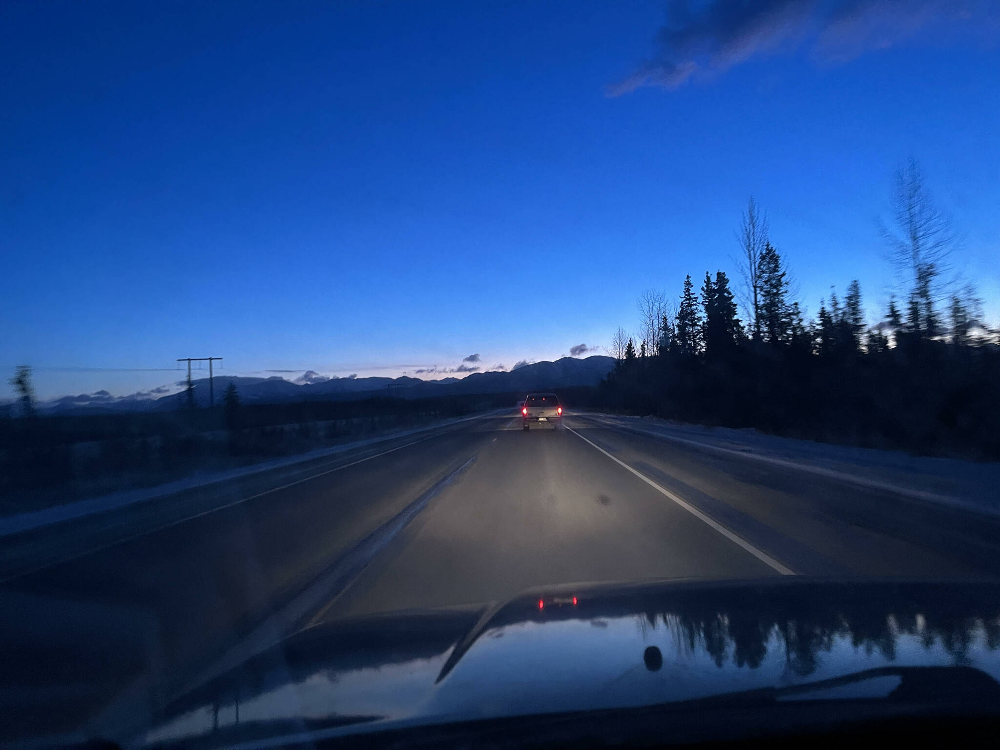 The sun rises over the mountains on the Sterling Highway on Saturday, Nov. 5, 2022, outside of Sterling, Alaska. (Jake Dye/Peninsula Clarion)