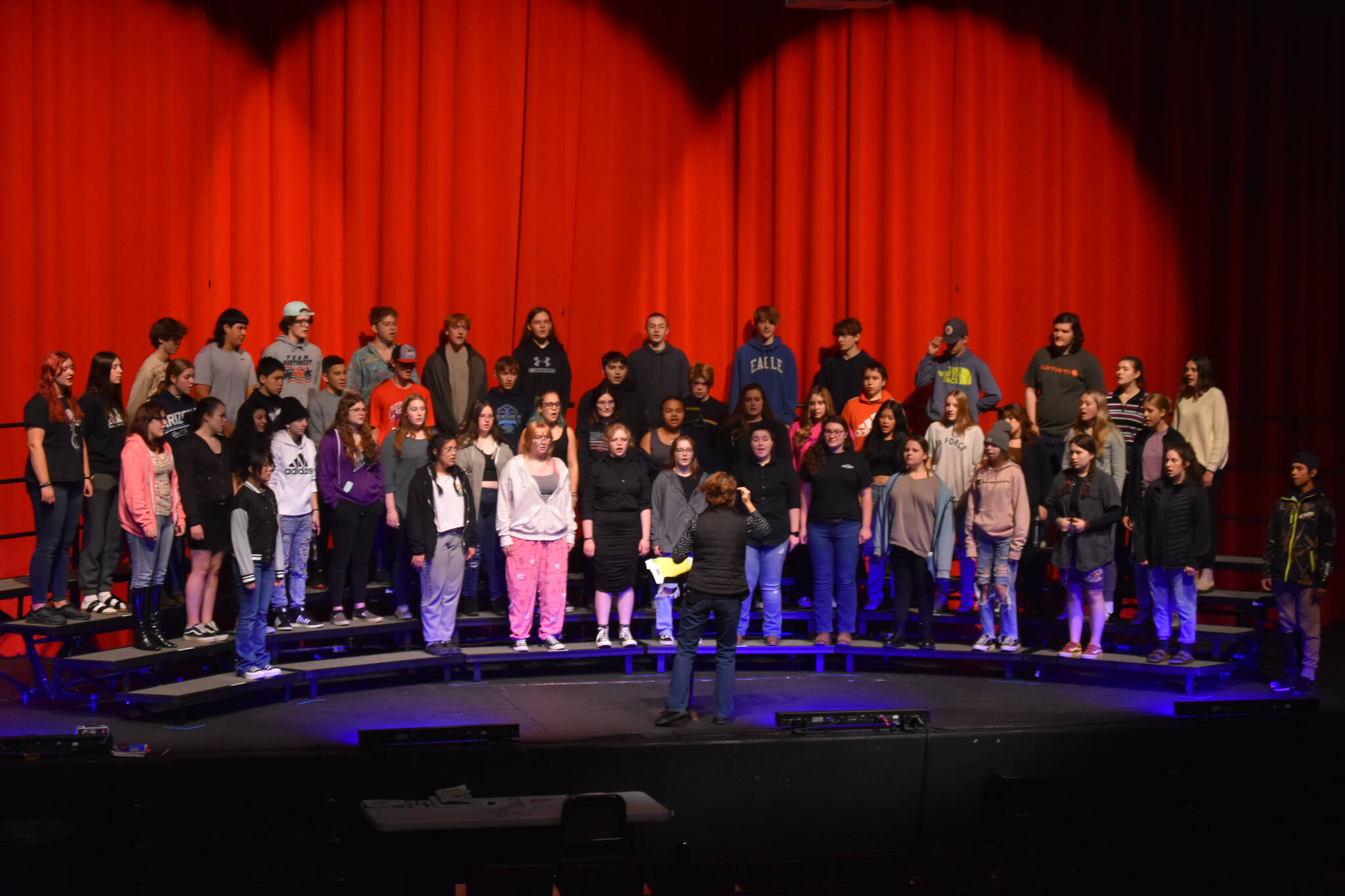 Audra Calloway directs the Soldotna High School Choir in a rehersal on Oct. 11, 2022, at Soldotna High School in Soldotna, Alaska. (Jake Dye/Peninsula Clarion)