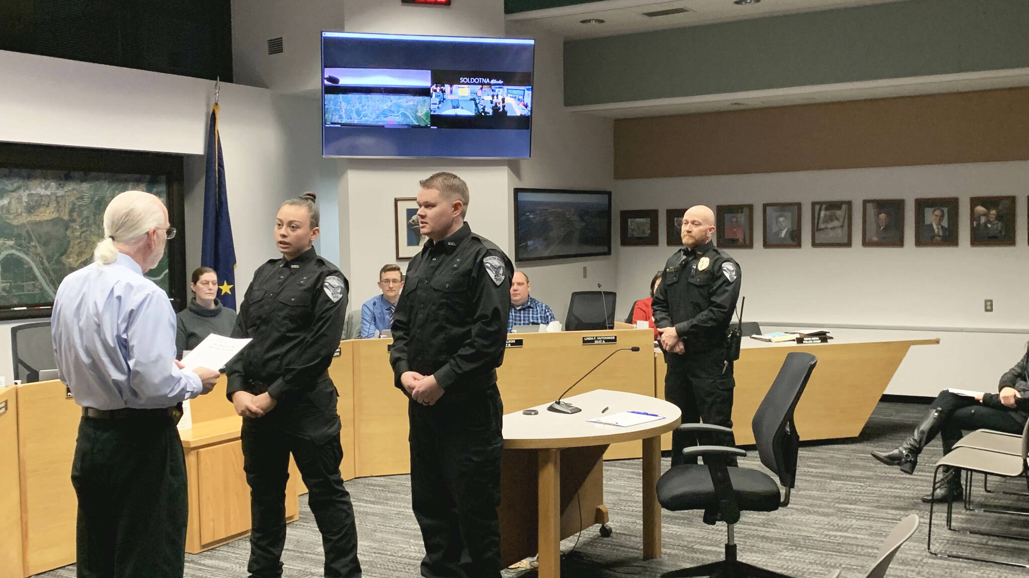 From left, Soldotna Mayor Paul Whitney swears in new Soldotna Police Officers AJ Fresquez and Reid Culver while Police Chief Dale "Gene" Meek looks on during a meeting of the Soldotna City Council on Wednesday, Nov. 9, 2022 in Soldotna, Alaska. (Ashlyn O'Hara/Peninsula Clarion)