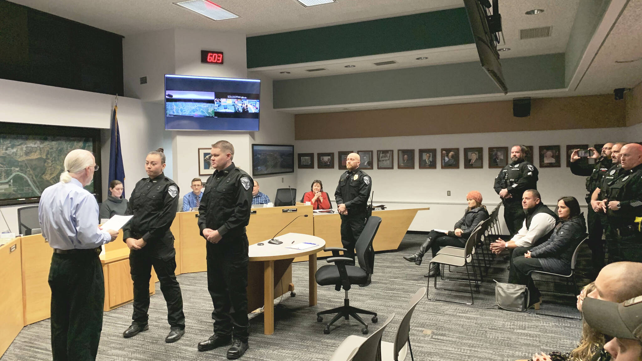 From left, Soldotna Mayor Paul Whitney swears in new Soldotna Police Officers AJ Fresquez and Reid Culver while Police Chief Dale "Gene" Meek and other officers look on during a meeting of the Soldotna City Council on Wednesday, Nov. 9, 2022 in Soldotna, Alaska. (Ashlyn O'Hara/Peninsula Clarion)