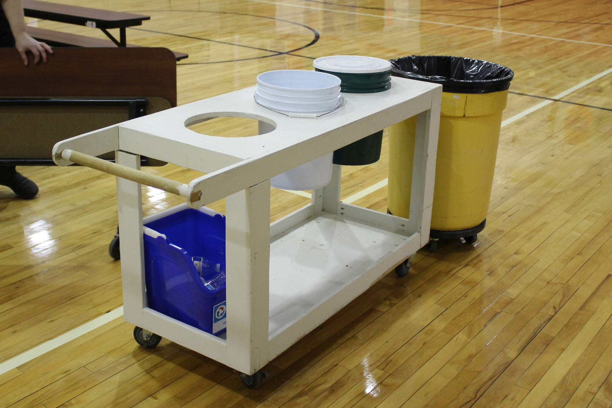 A cart made by a school custodian holds buckets inside the Sterling Elementary School gymnasium on Thursday, Nov. 10, 2022, in Sterling, Alaska. (Ashlyn O’Hara/Peninsula Clarion)