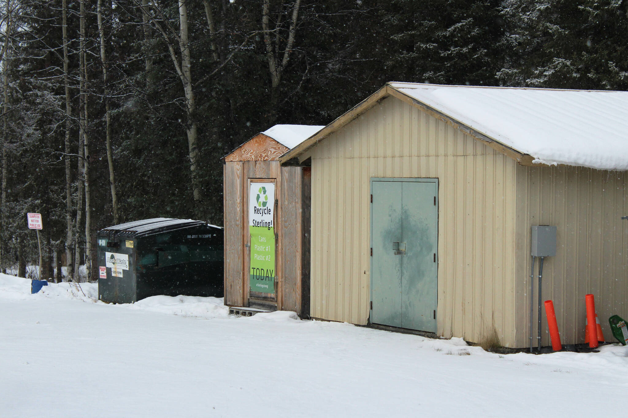 Snow falls on a recycling shed outside of Sterling Elementary School on Thursday, Nov. 10, 2022 in Sterling, Alaska. (Ashlyn O’Hara/Peninsula Clarion)