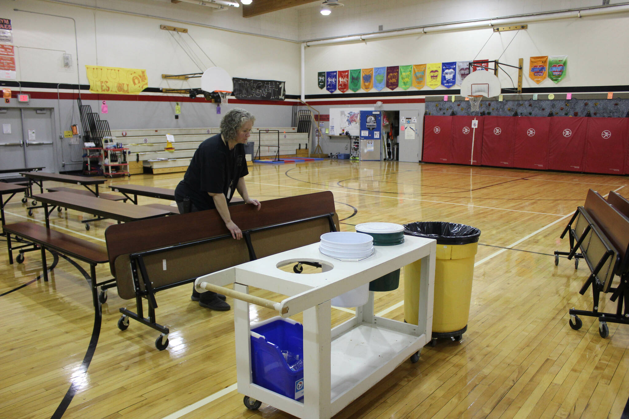 Principal Denise Kelly helps set up lunch materials at Sterling Elementary School on Thursday, Nov. 10, 2022, in Sterling, Alaska. (Ashlyn O’Hara/Peninsula Clarion)