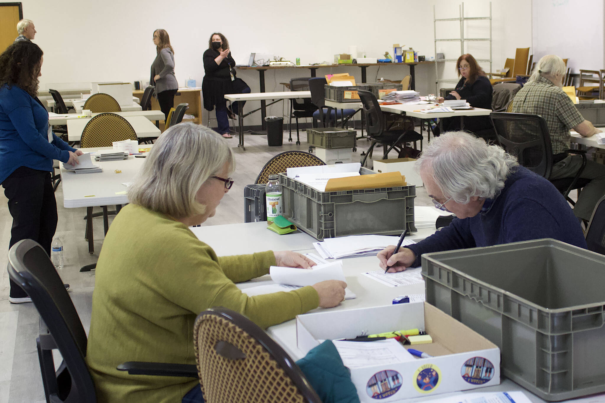 Pat Tynan, left, and Tom Melville, review absentee ballots Tuesday, Nov. 15, 2022, at the Division of Elections office at the Mendenhall Mall in Juneau, Alaska. The review process is taking place in a separate room from where ballots are being tallied for the official results. (Mark Sabbatini / Juneau Empire)
Pat Tynan, left, and Tom Melville, review absentee ballots Tuesday, Nov. 15, 2022, at the Division of Elections office at the Mendenhall Mall in Juneau, Alaska. The review process is taking place in a separate room from where ballots are being tallied for the official results. (Mark Sabbatini / Juneau Empire)
