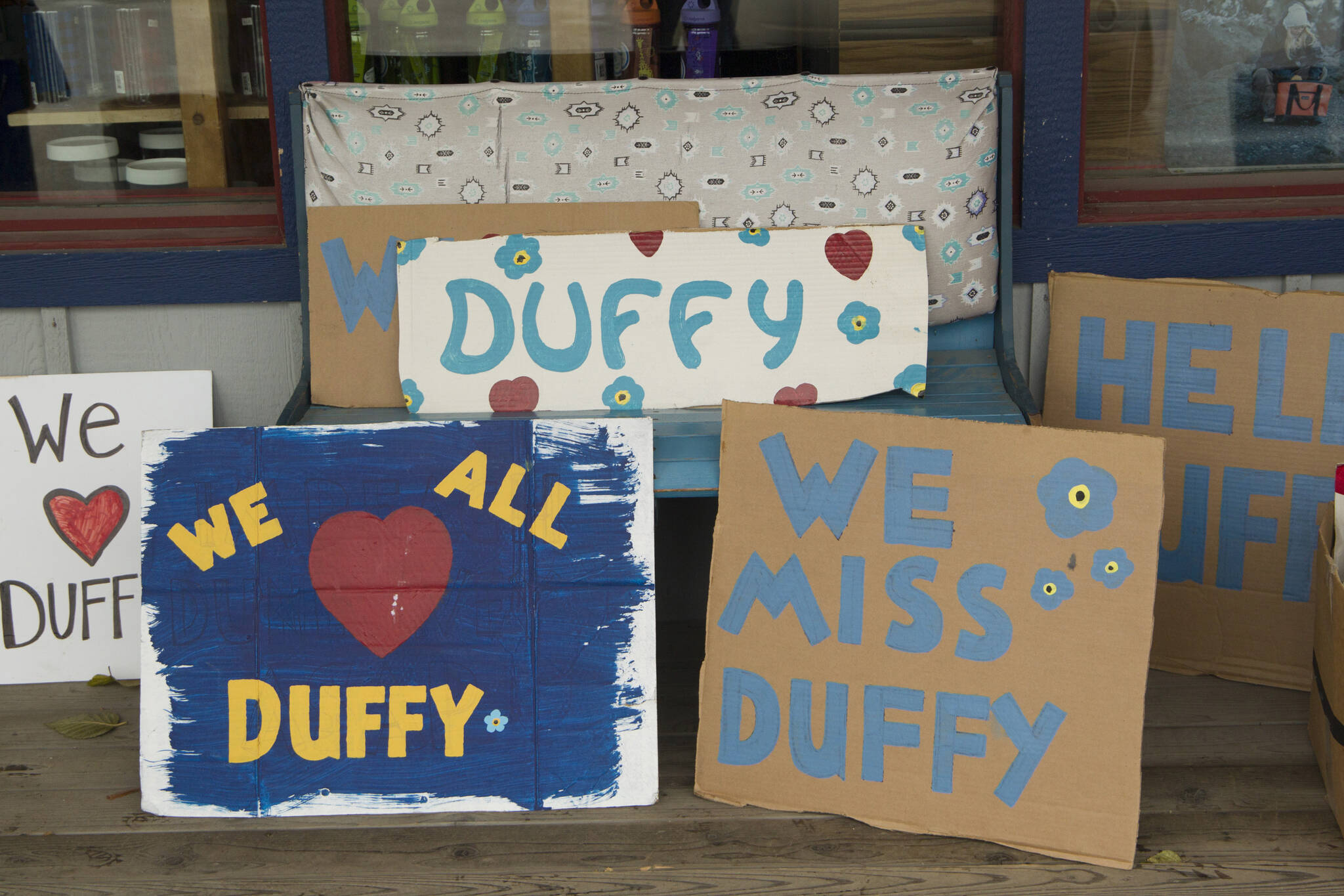 Signs in honor of Duffy Murnane were available for people to hold while retracing her last known steps during the memorial walk on Saturday, Oct. 17, 2021. (Photo by Sarah Knapp/Homer News)