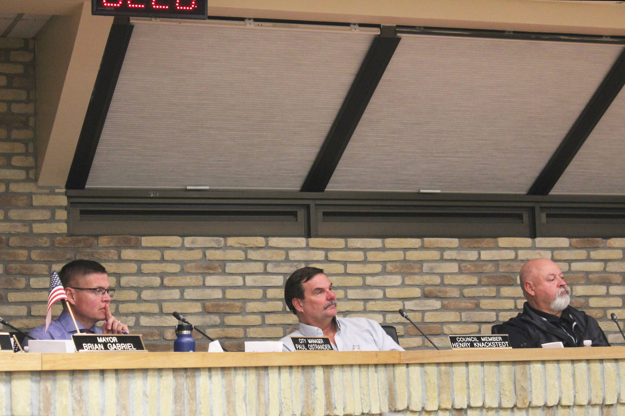 From left: Kenai City Manager Paul Ostrander, Kenai City Council member Henry Knackstedt and Kenai Vice Mayor James Baisden listen to public testimony during a city council meeting on Wednesday, Nov. 16, 2022, in Kenai, Alaska. (Ashlyn O’Hara/Peninsula Clarion)