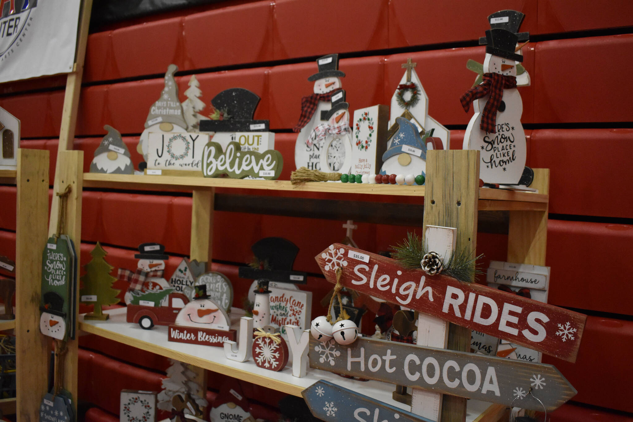 Snowman and Christmas themed crafts are seen ready to be sold at the Kenai Arts & Crafts Fair during early set up at Kenai Central High School in Kenai, Alaska, on Wednesday, Nov. 23, 2022. (Jake Dye/Peninsula Clarion)