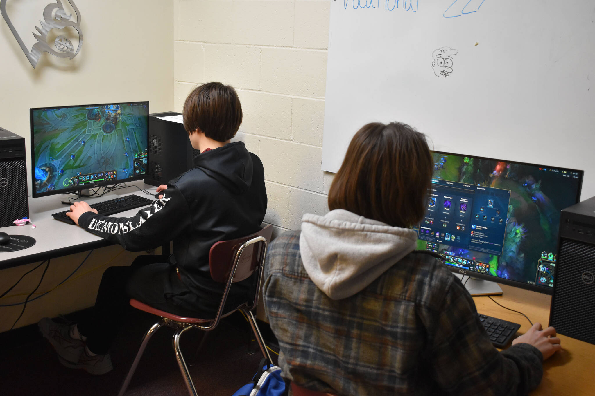 Jackson Anding and Cody Good participate in a practice League of Legends match on Tuesday, Nov. 22, 2022 at Kenai Central High School in Kenai, Alaska. (Jake Dye/Peninsula Clarion)