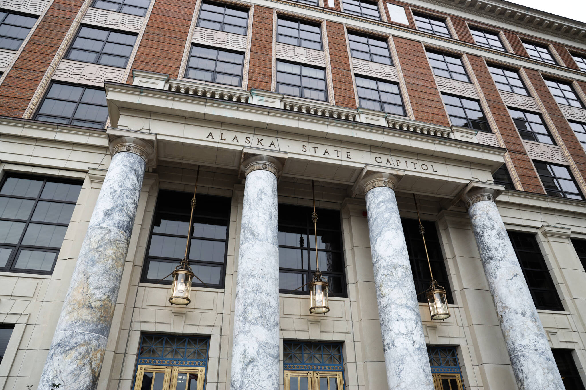 The Alaska State Capitol awaits a legislators forming new majority coalitions and the return of Gov. Mike Dunleavy after the winners of the general election were announced Wednesday. The Senate will have a 17-member bipartisan ruling coalition, while the House arrangement remains uncertain due to at least one likely recount and questions about partisan alignments. (Clarise Larson / Juneau Empire)