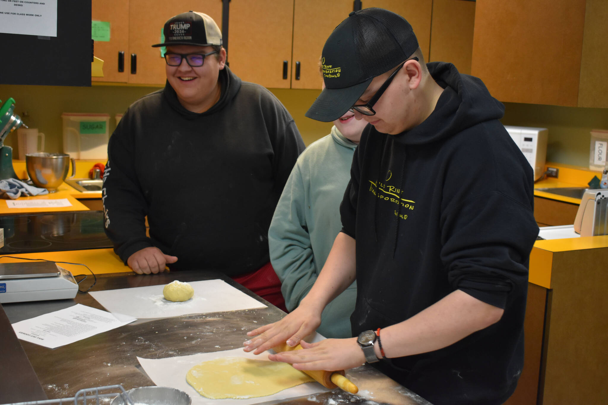 Kenai Central High School Culinary Students roll out dough for Christmas cookies as part of bake sale preparation on Tuesday, Nov. 29, 2022, at Kenai Central High School in Kenai, Alaska. (Jake Dye/Peninsula Clarion)
