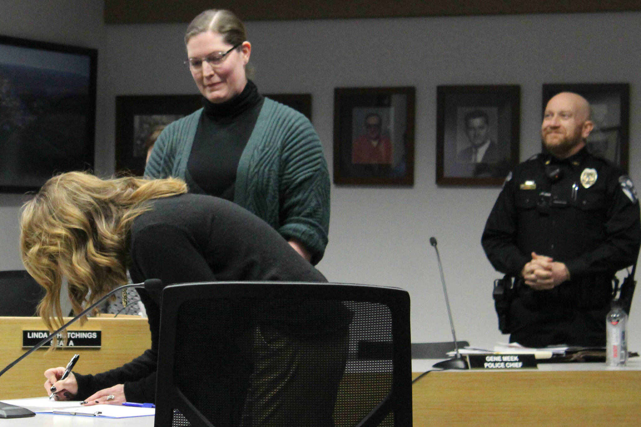 Johni Blankenship signs her name after being sworn in as Soldotna City Clerk at a city council meeting on Wednesday, Nov. 30, 2022, in Soldotna, Alaska. (Ashlyn O’Hara/Peninsula Clarion)