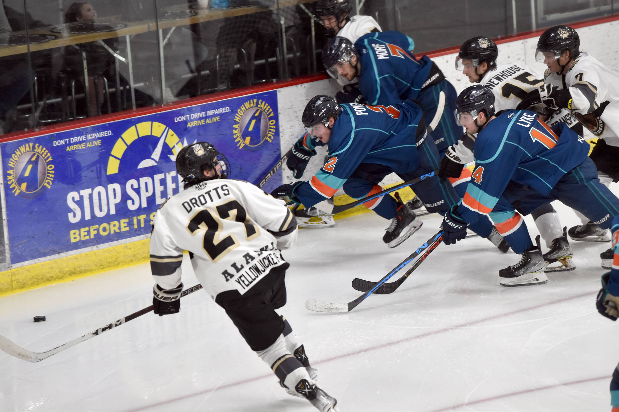 The Kenai River Brown Bears and Anchorage Wolverines battle for the puck Saturday, Nov. 19, 2022, at the Soldotna Regional Sports Complex. (Photo by Jeff Helminiak/Peninsula Clarion)