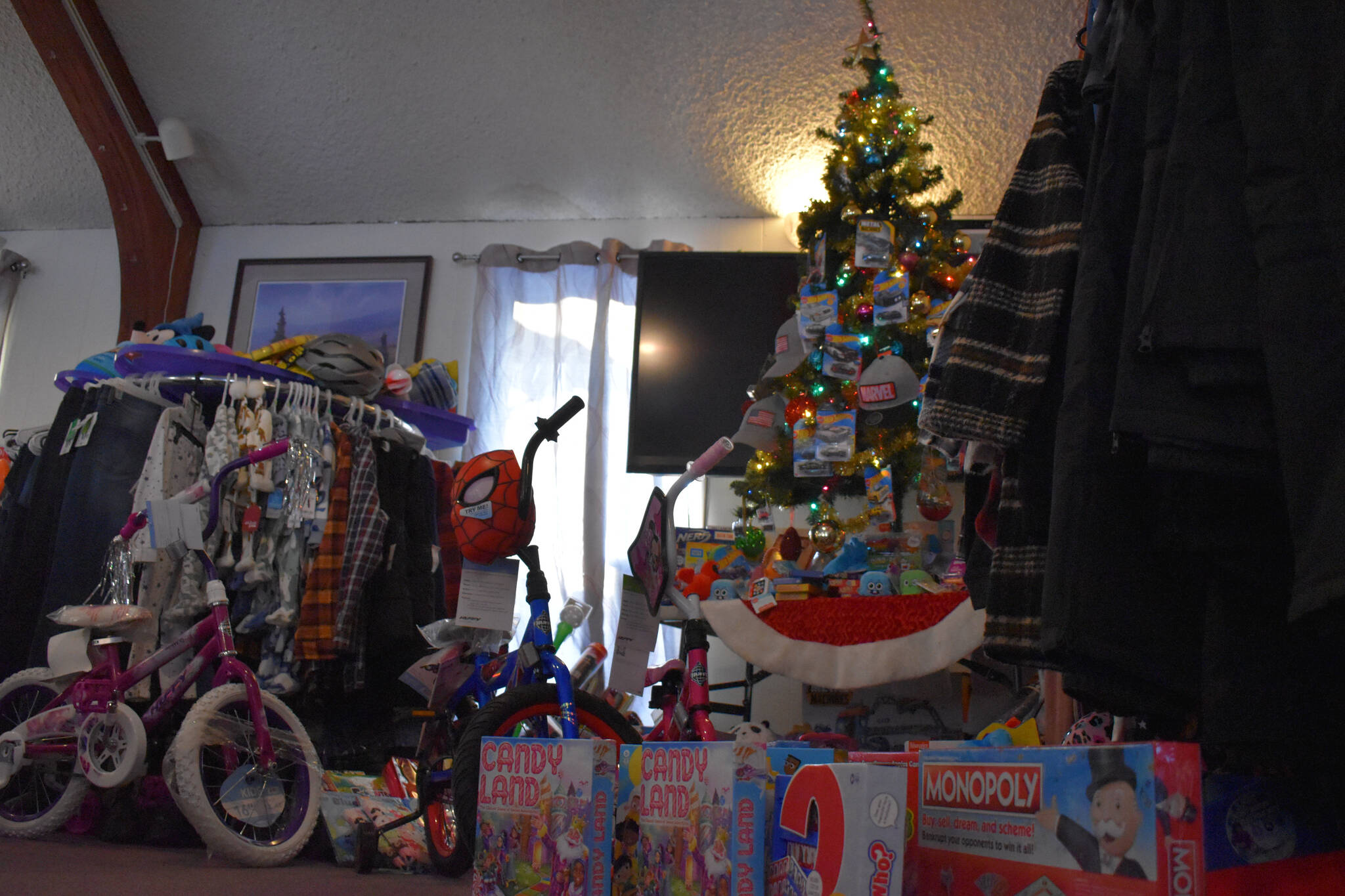 Toys and clothes are displayed, ready to be donated, at the Soldotna Elks Lodge #2706 in Soldotna, Alaska, on Friday, Dec. 2, 2022. (Jake Dye/Peninsula Clarion)