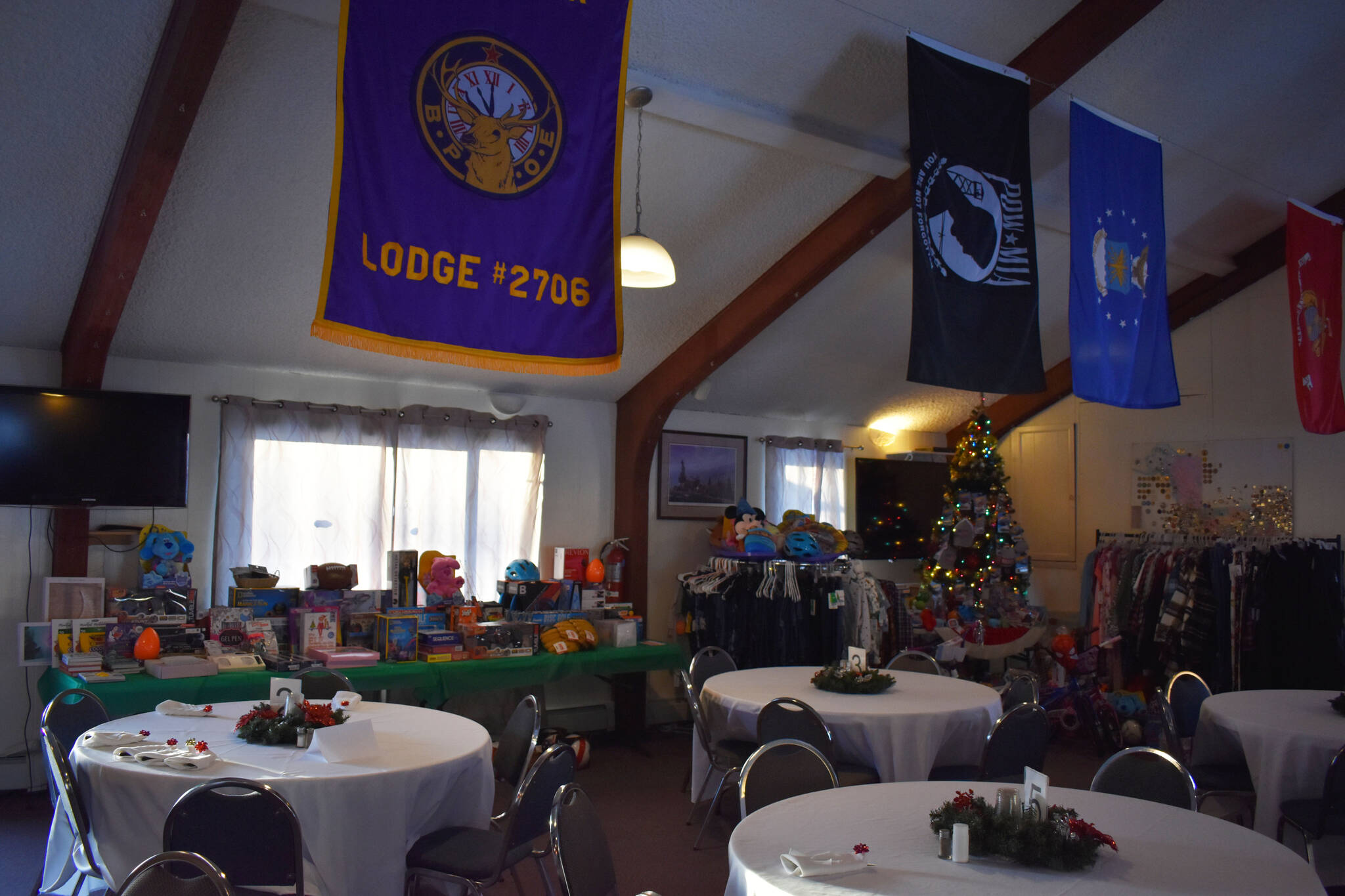 Toys and clothes are displayed, ready to be donated, at the Soldotna Elks Lodge #2706 in Soldotna, Alaska, on Friday, Dec. 2, 2022. (Jake Dye/Peninsula Clarion)