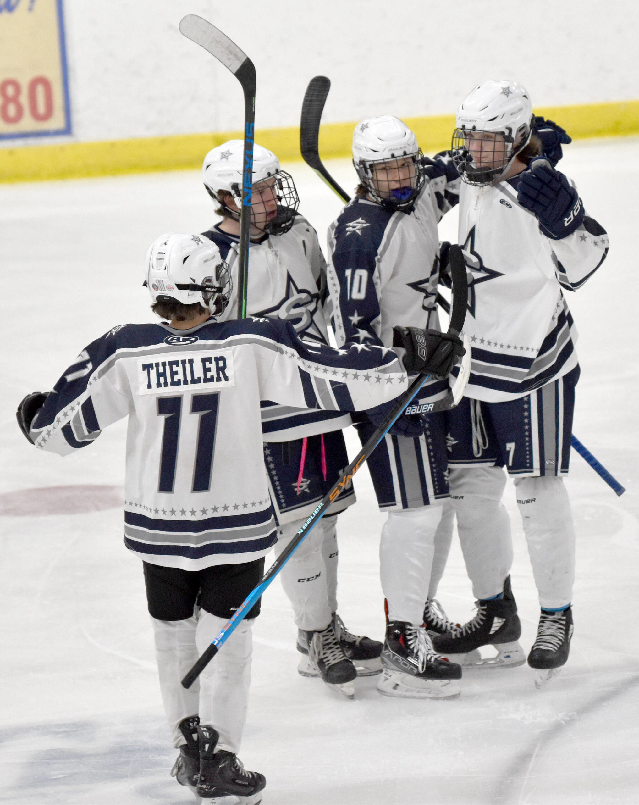 Soldotna celebrates a first-period goal by Jace Applehans (far right) on Friday, Dec. 2, 2022, at the Soldotna Regional Sports Complex in Soldotna, Alaska. (Photo by Jeff Helminiak/Peninsula Clarion)