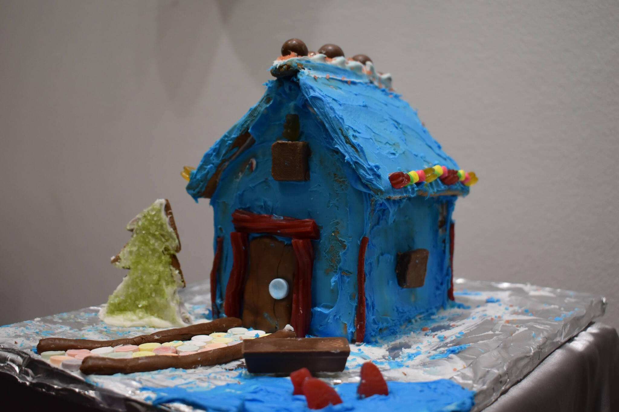 A gingerbread house designed by Henry Franklin is displayed at the Kenai Chamber of Commerce and Visitor Center on Tuesday, Dec. 6, 2022. (Jake Dye/Peninsula Clarion)