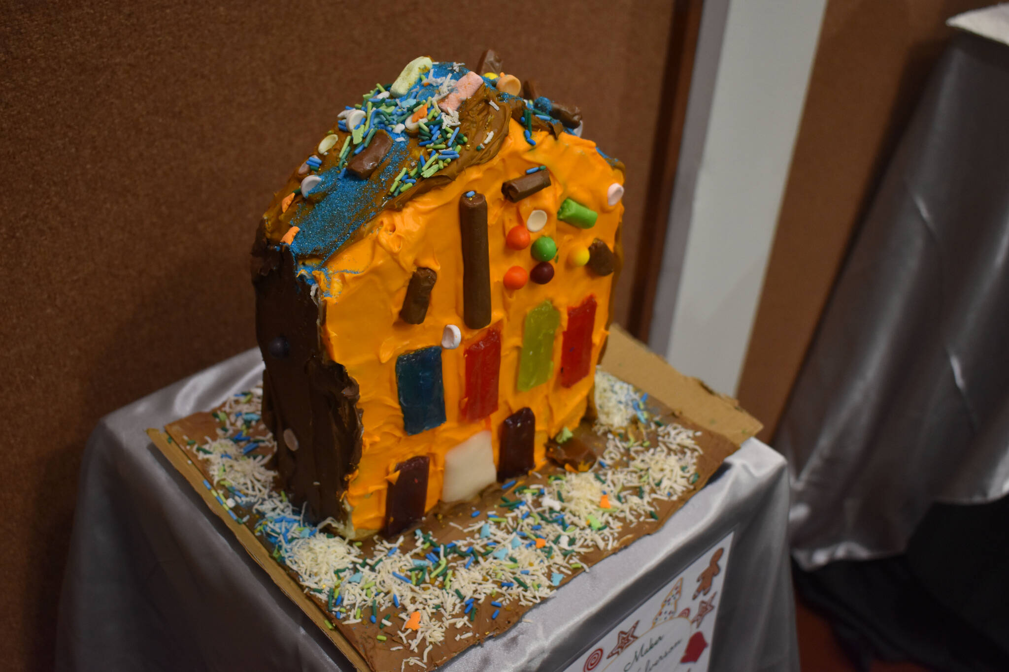 A gingerbread house designed by Hogarth Halverson is displayed at the Kenai Chamber of Commerce and Visitor Center on Tuesday, Dec. 6, 2022. (Jake Dye/Peninsula Clarion)