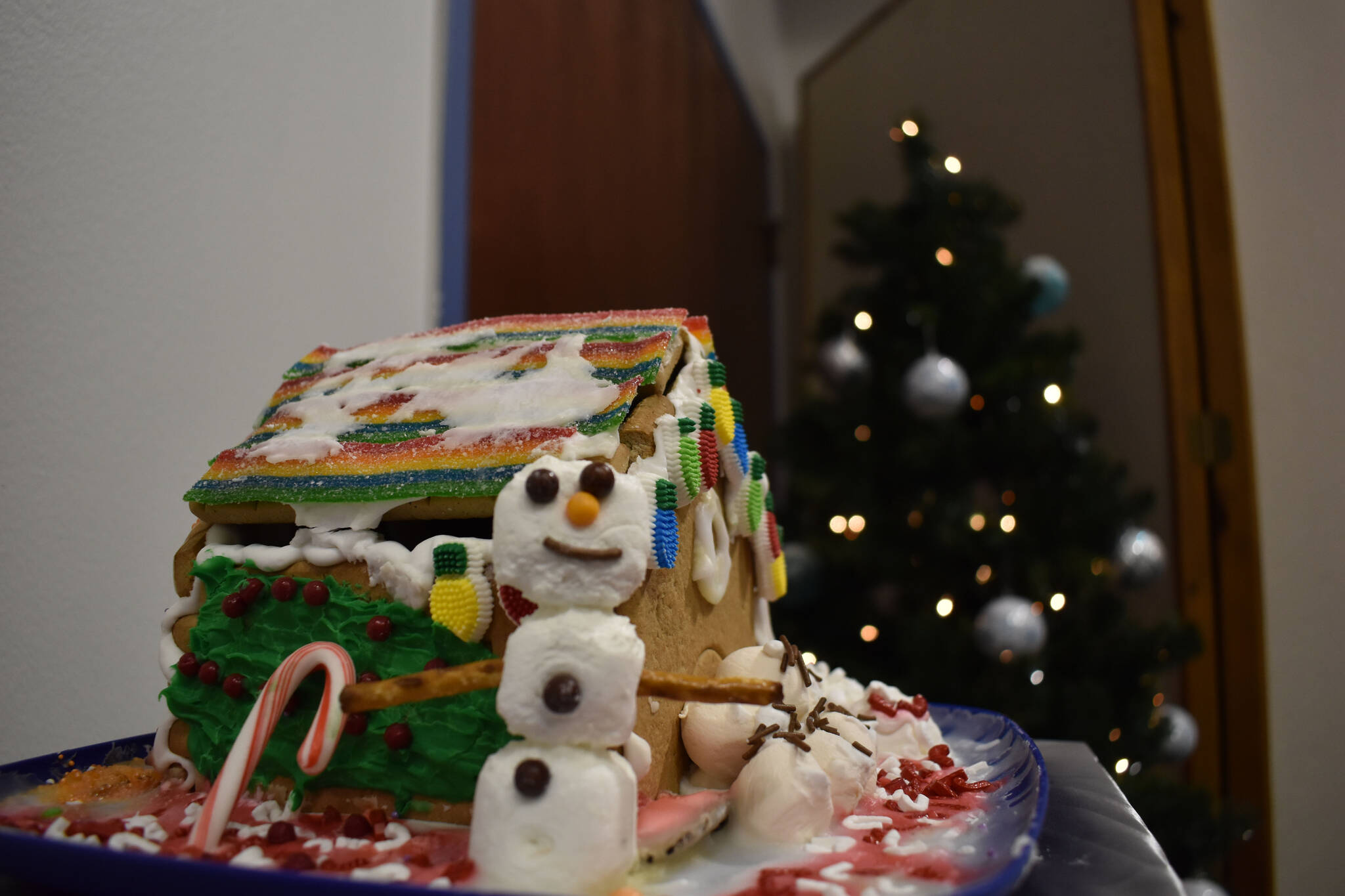 A gingerbread house designed by Ulysses Haberman is displayed at the Kenai Chamber of Commerce and Visitor Center on Tuesday, Dec. 6, 2022. (Jake Dye/Peninsula Clarion)