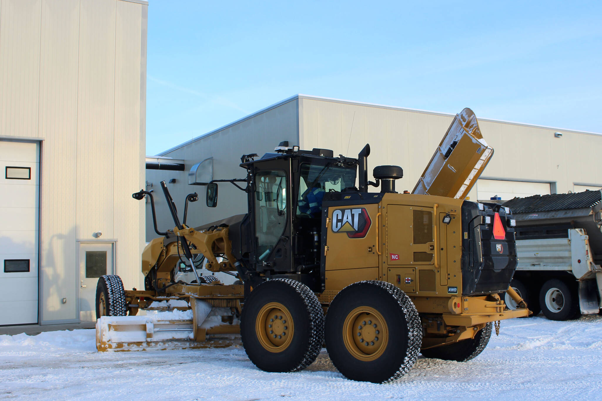 A grader owned by the City of Kenai is parked outside of the city shop on Wednesday, Dec. 7, 2022, in Kenai, Alaska. (Ashlyn O’Hara/Peninsula Clarion)