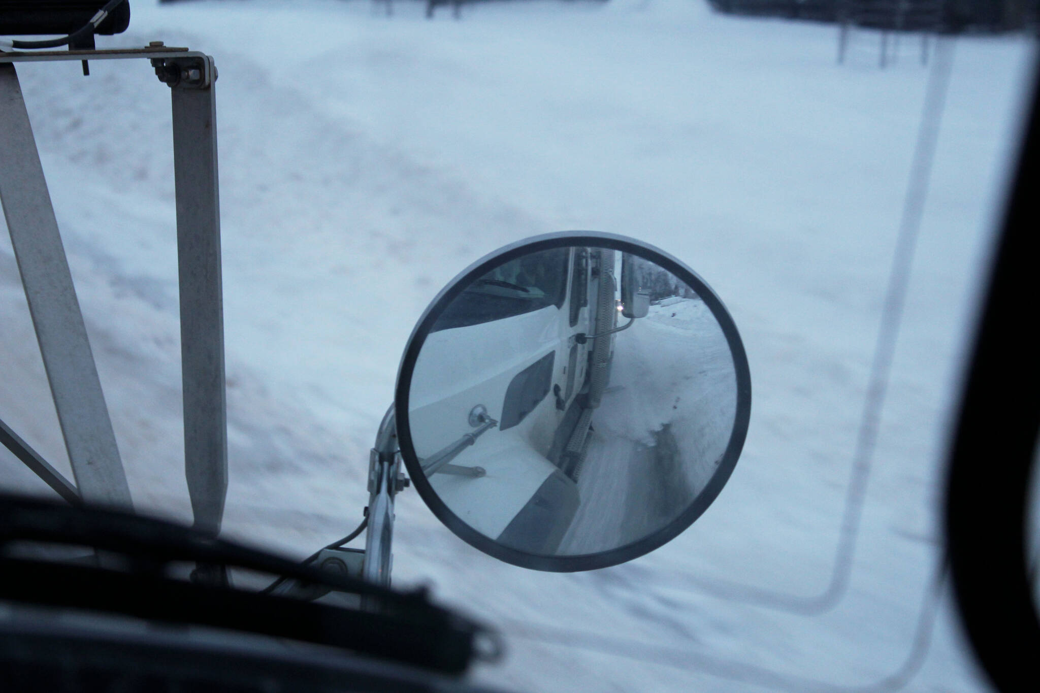 A City of Kenai sander, equipped with a belly blade, moves snow from a roadway on Wednesday, Dec. 7, 2022, in Kenai, Alaska. (Ashlyn O’Hara/Peninsula Clarion)