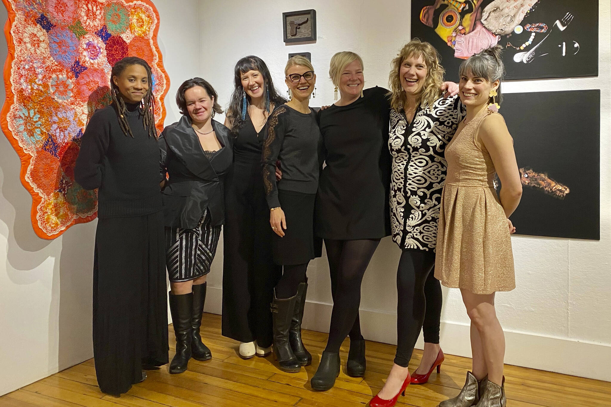 The artists who created the Mother exhibit pose for a group photo on Friday, Dec. 2, 2022, at Bunnell Street Arts Center in Homer. From left to right are Myesha Callahan Freet, Lily Wooshkindein Da.Aat Hope, Brianna Allen, Amy Meissner, Somer Hahm, Amy Komar and Carla Kilnker Cope. (Photo by Adele Person.)