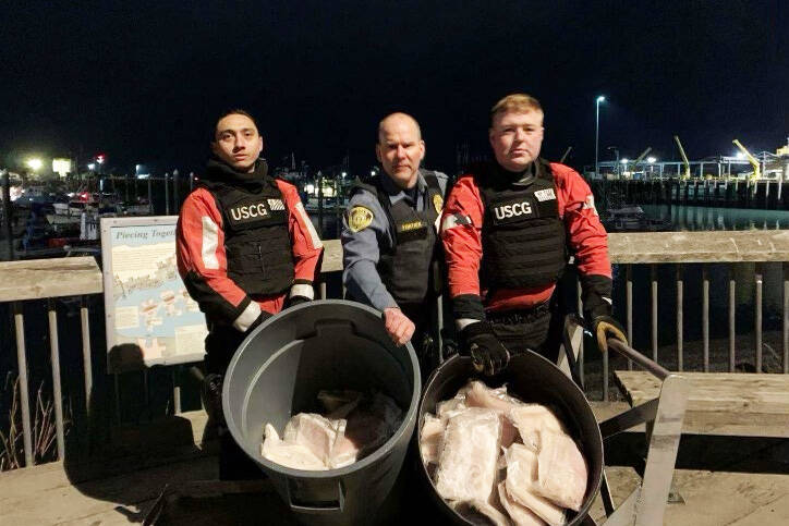 U.S. Coast Guard courtesy photo

Two crewmembers from Coast Guard Cutter Naushon and a member from the National Oceanic and Atmospheric Administration Office of Law Enforcement (NOAA OLE) pose for a picture with allegedly illegally-retained halibut in Homer, Alaska, Wednesday, Nov. 30, 2022. While conducting a boarding of a commercial fishing vessel, a Cutter Naushon boarding team member discovered a total of 117 pounds of illegally-retained halibut aboard the vessel and handed them over to NOAA OLE representatives in Homer.