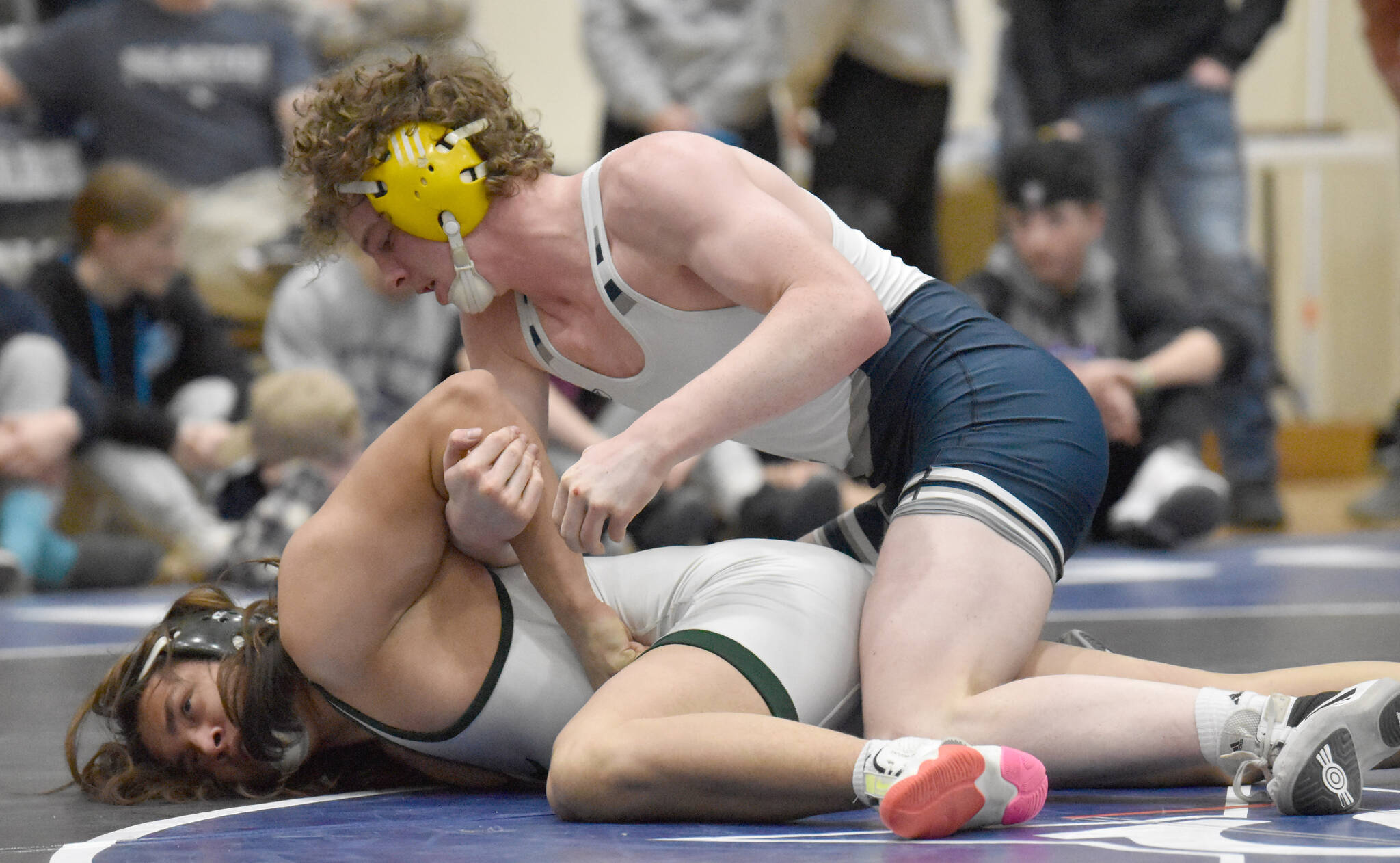 Soldotna’s Hunter Richardson tops Colony’s Raif Floresta for the Northern Lights Conference title at 189 pounds Saturday, Dec. 10, 2022, at Soldotna High School in Soldotna, Alaska. (Photo by Jeff Helminiak/Peninsula Clarion)
