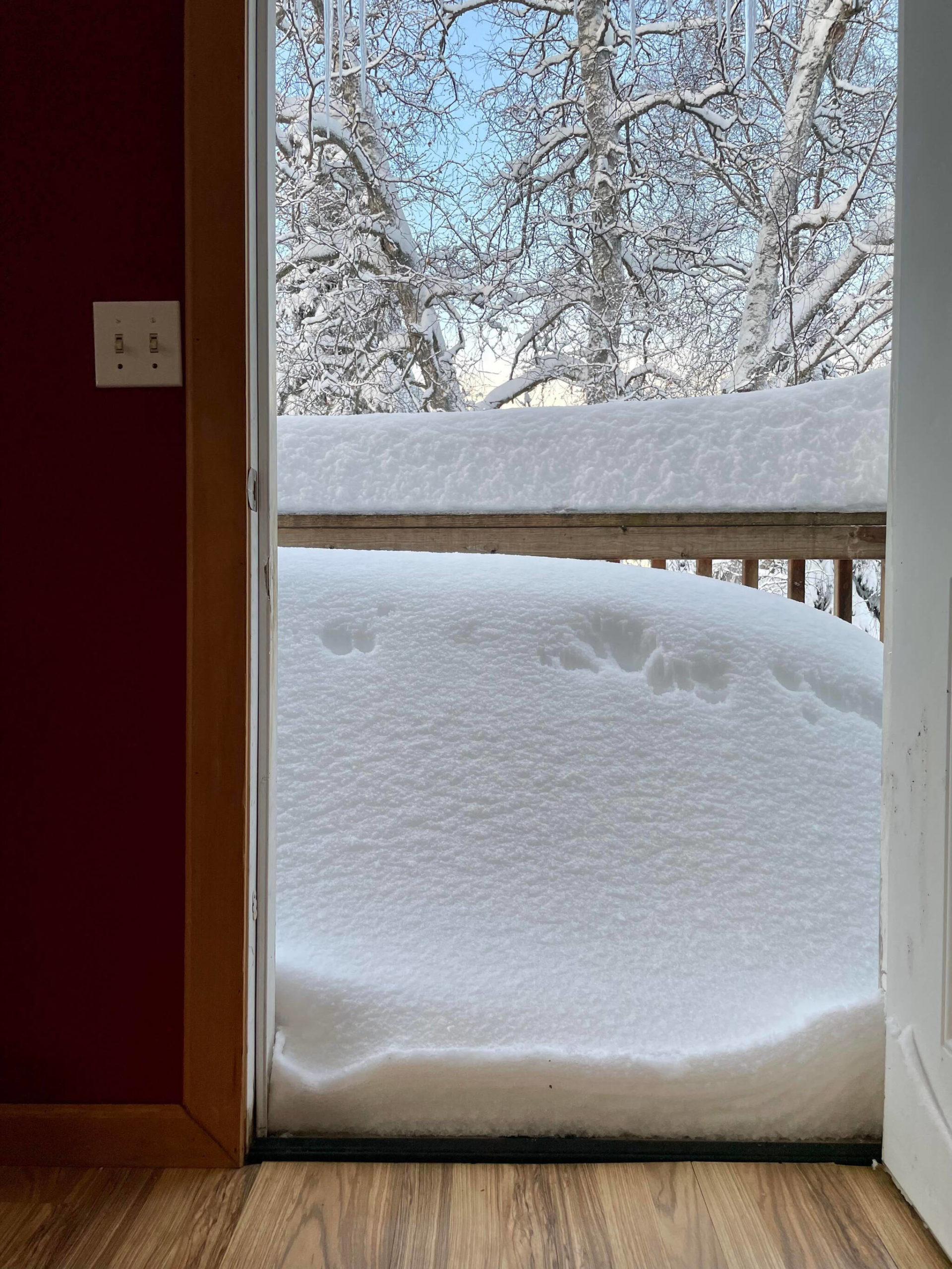 Snow blocks the doorway of a home on West Riverview Avenue area in Soldotna, Alaska, on Monday, Dec. 12, 2022. (Photo courtesy Matthew Rundle)