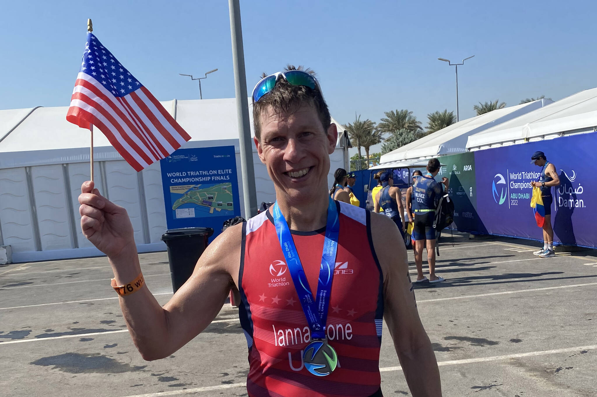 Jon Iannaccone waves an American flag while wearing a medal after completing the World Triathlon Championships in Abu Dhabi, United Arab Emirates, Nov. 26, 2022. (Photo courtesy Jon Iannaccone)
Jon Iannaccone waves an American flag while wearing a medal after completing the World Triathlon Championships in Abu Dhabi, United Arab Emirates, Nov. 26, 2022. (Photo courtesy Jon Iannaccone)