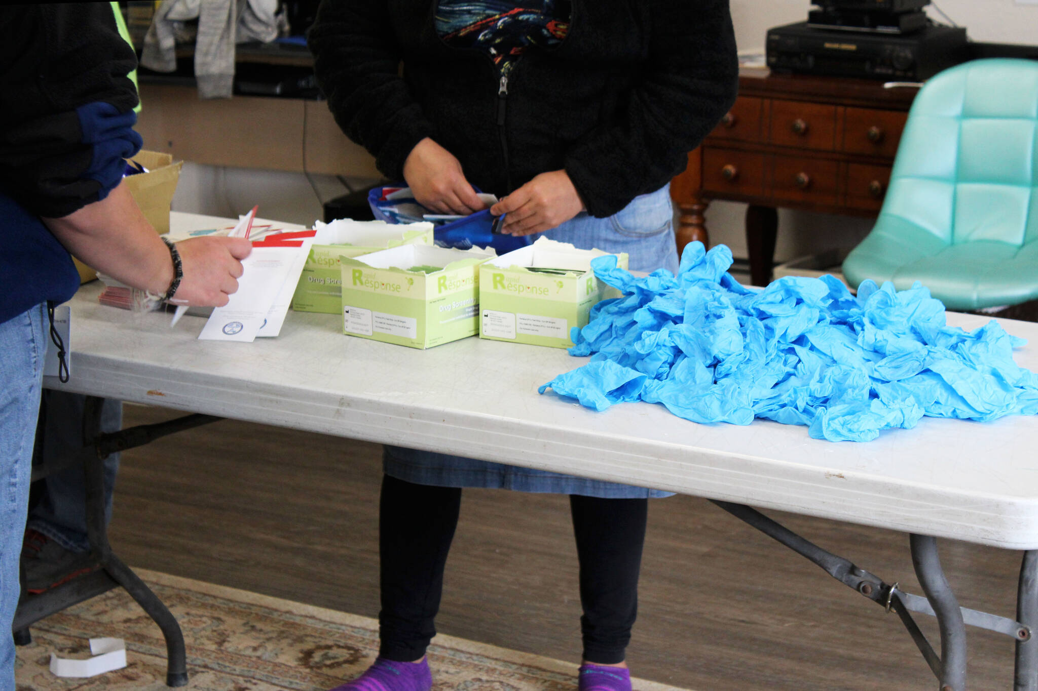 People assemble Narcan kits on Thursday, Aug. 12, 2021, at Freedom House in Soldotna, Alaska. The Kenai Peninsula Borough Assembly during their Tuesday, Dec. 13, 2022, meeting accepted another $30,000 payment as part of a nationwide opioid settlement, which will be put toward opioid remediation in the borough. (Ashlyn O’Hara/Peninsula Clarion)