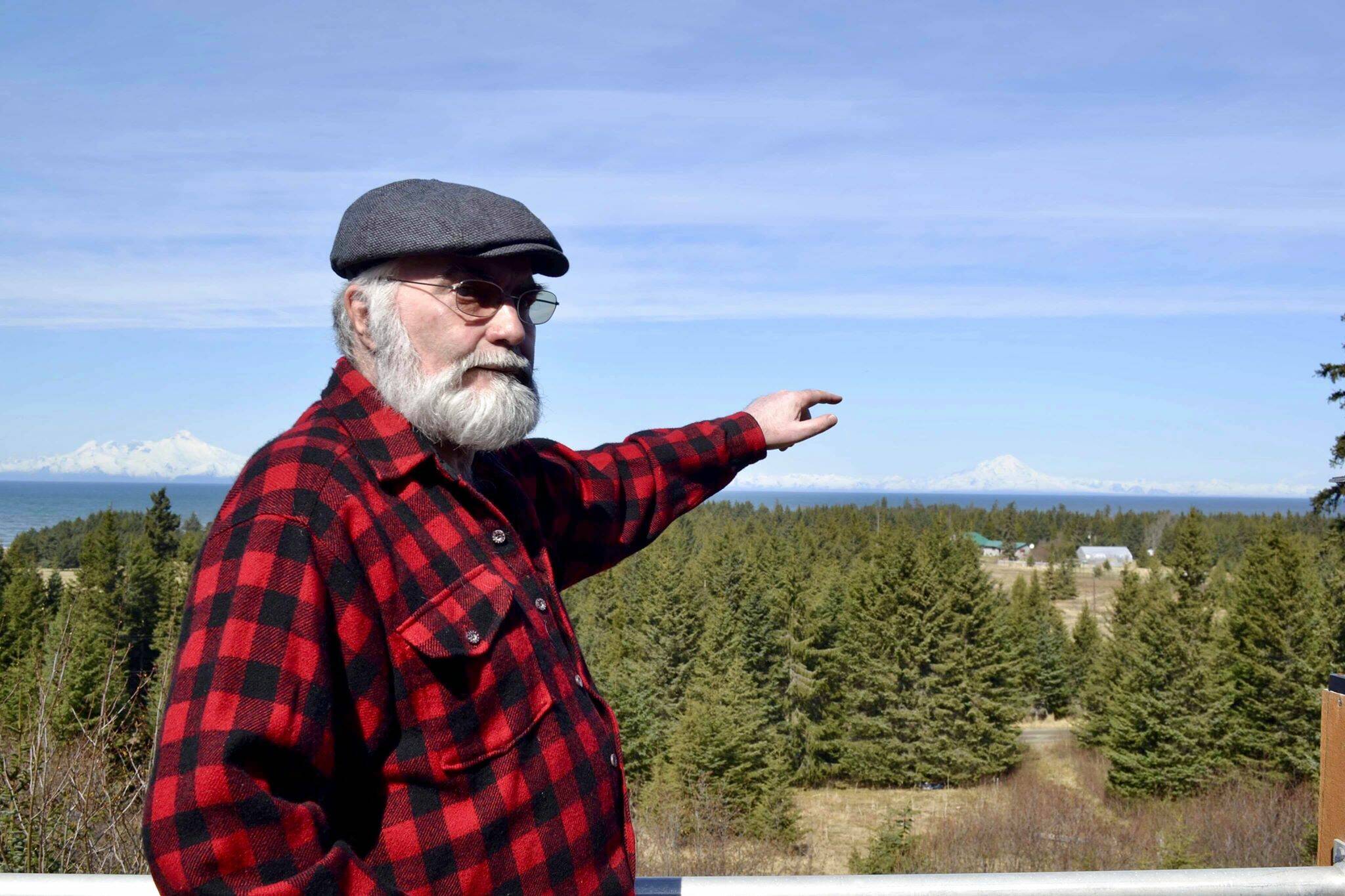 Pete Kineen, a neighbor of the proposed Beachcomber LLC gravel pit, stands on his deck and points to where the pit could be, on May 2, 2019, in Anchor Point, Alaska. (Photo by Victoria Petersen/Peninsula Clarion)
Pete Kineen, a neighbor of the proposed Beachcomber LLC gravel pit, stands on his deck and points to where the pit could be, on May 2, 2019, in Anchor Point, Alaska. (Photo by Victoria Petersen/Peninsula Clarion)