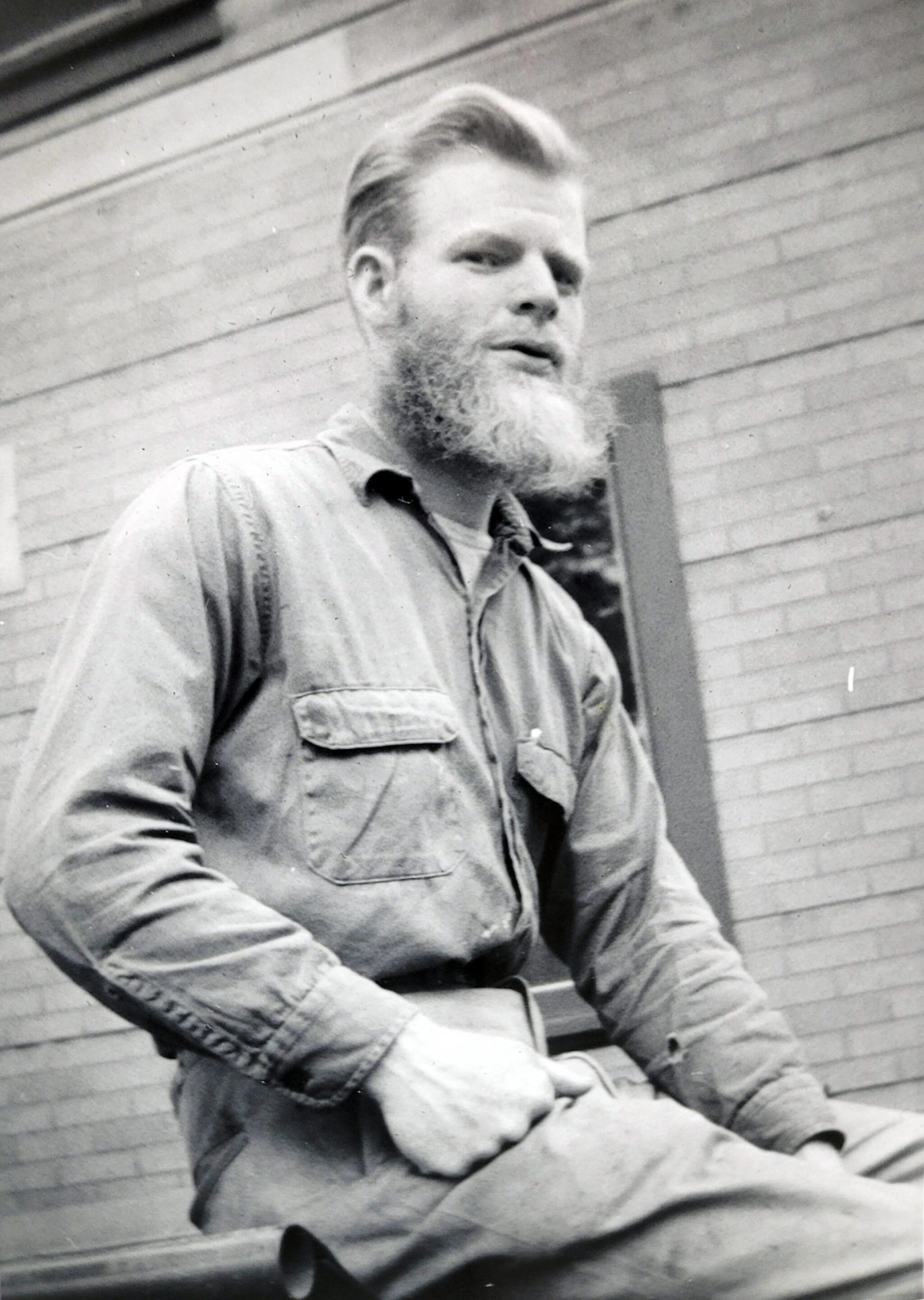 Photo courtesy of Ben and Marian Goble 
Ben Goble sits on the porch of the Goble’s house/clinic on what is now McCollum Drive in Kenai, circa 1959-60.