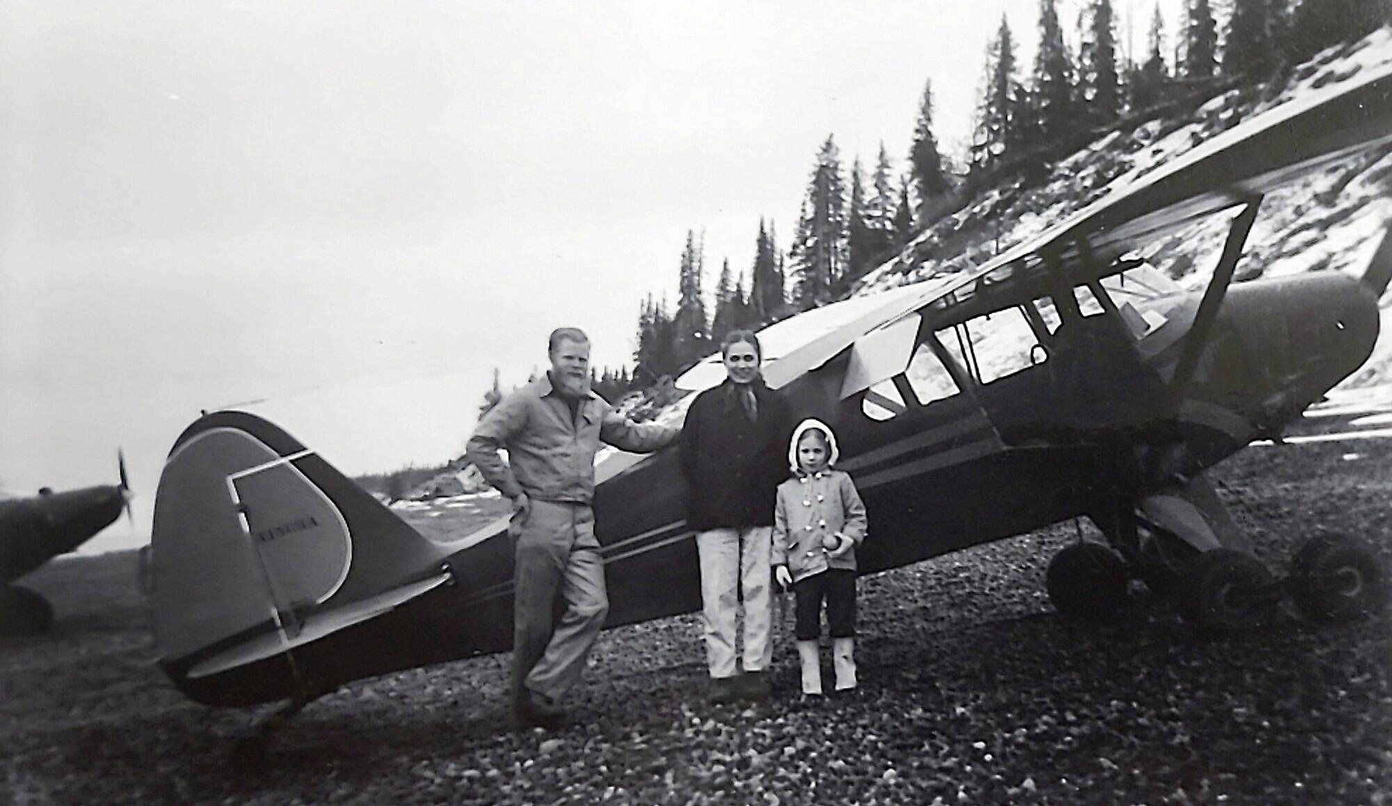 Ben, Marian and Grace Goble pose next to Ben’s airplane on the beach near Kenai in 1959. (Photo courtesy of Ben and Marian Goble)