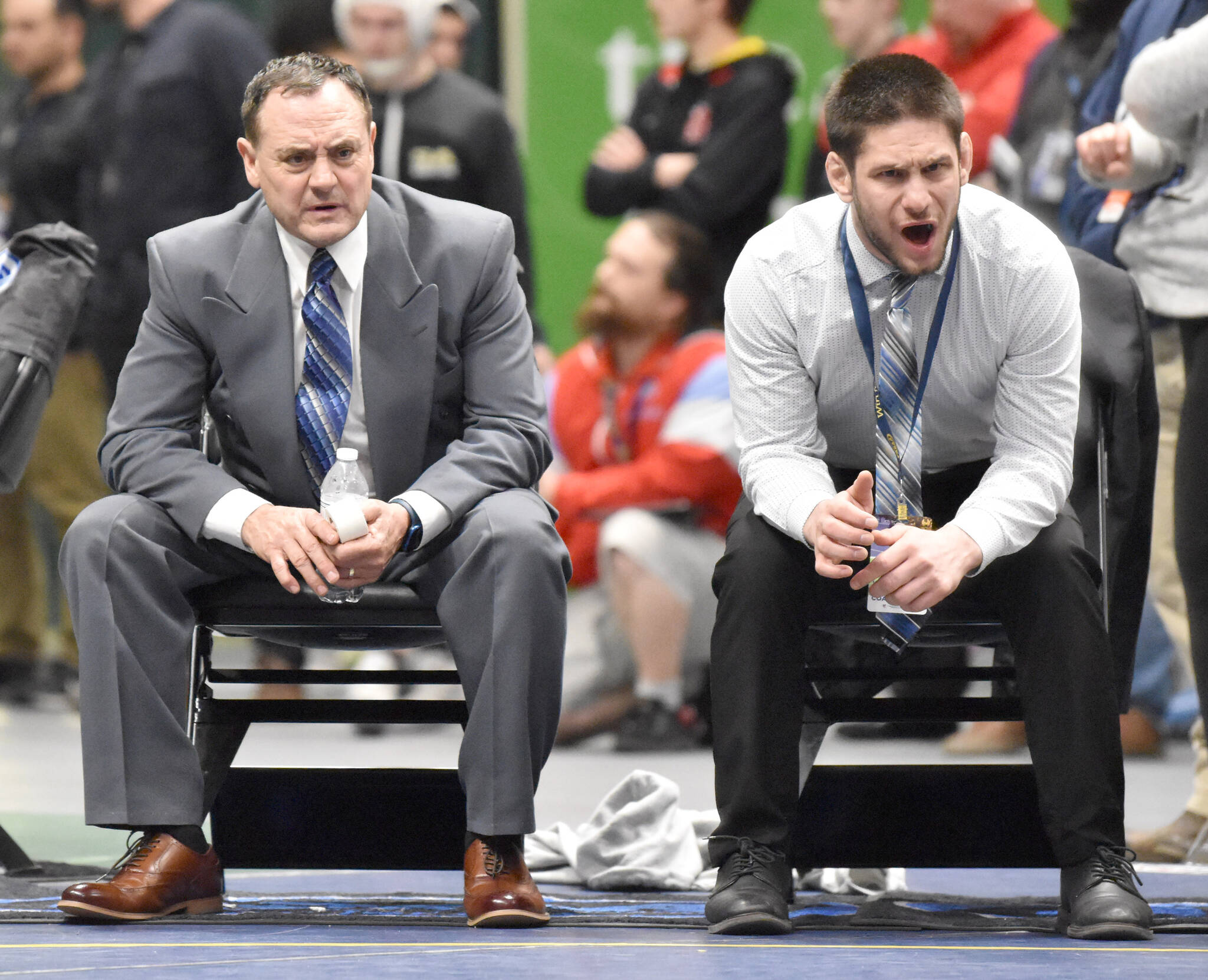 Soldotna head coach Neldon Gardner and Soldotna assistant Aaron Gordon coach their last meet for the Stars on Saturday, Dec. 18, 2022, at the state wrestling tournament at the Alaska Airlines Center in Anchorage, Alaska. (Photo by Jeff Helminiak/Peninsula Clarion)