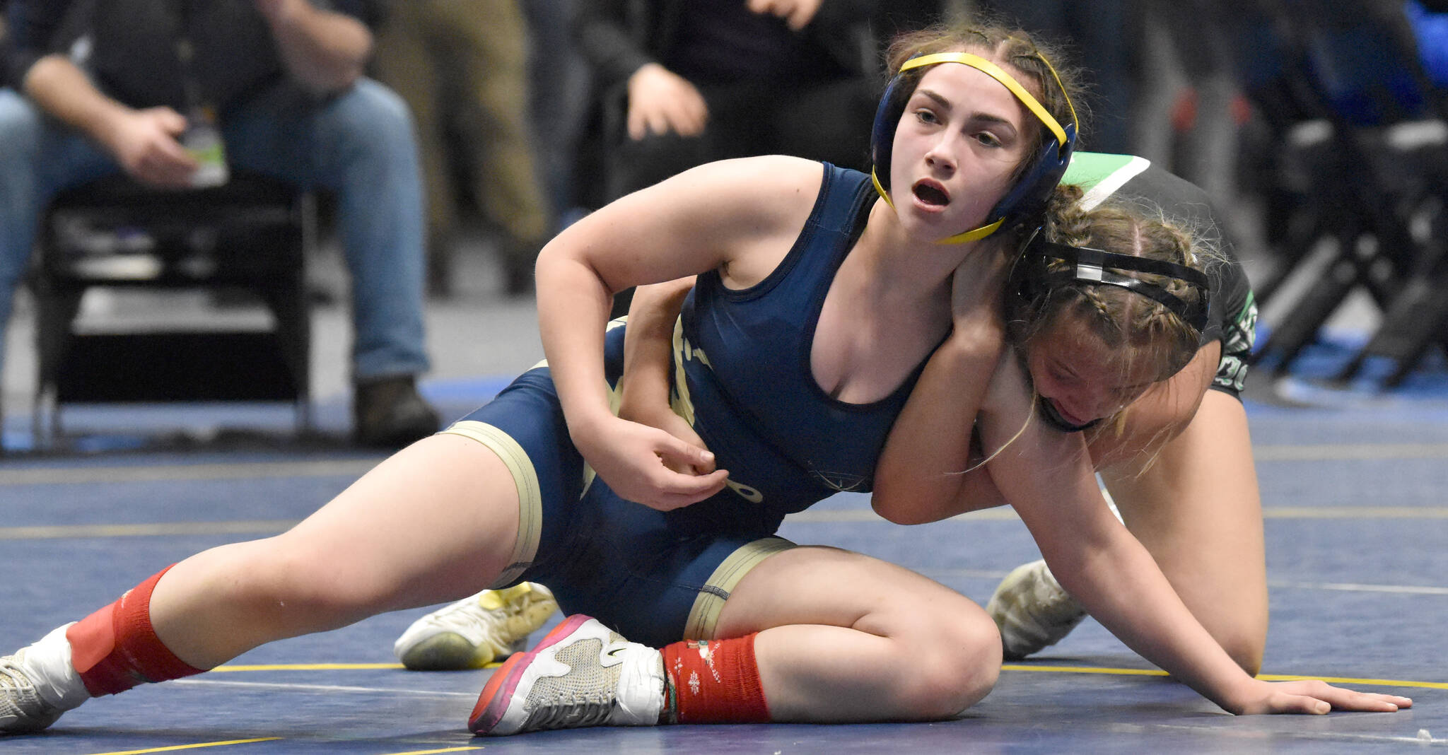 Homer’s Saoirse Cook defeats Colony’s Bayleigh Harrington for the Girls state title at 126 pounds Saturday, Dec. 18, 2022, at the state wrestling tournament at the Alaska Airlines Center in Anchorage, Alaska. (Photo by Jeff Helminiak/Peninsula Clarion)