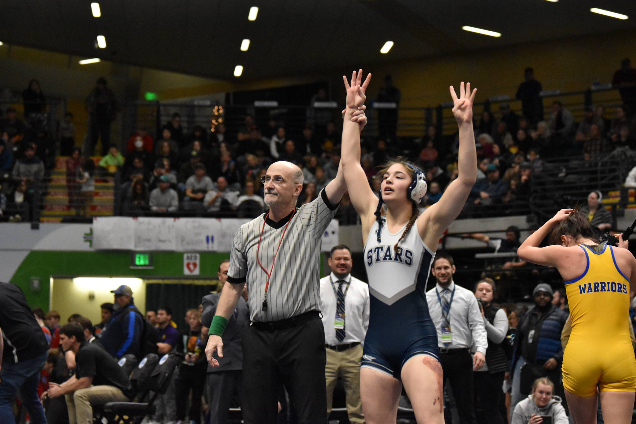 Soldotna senior Trinity Donovan celebrates her fourth state championship Saturday, Dec. 17, 2022, at the Girls state wrestling tournament at the Alaska Airlines Center in Anchorage, Alaska. (Photo by Jeff Helminiak/Peninsula Clarion)